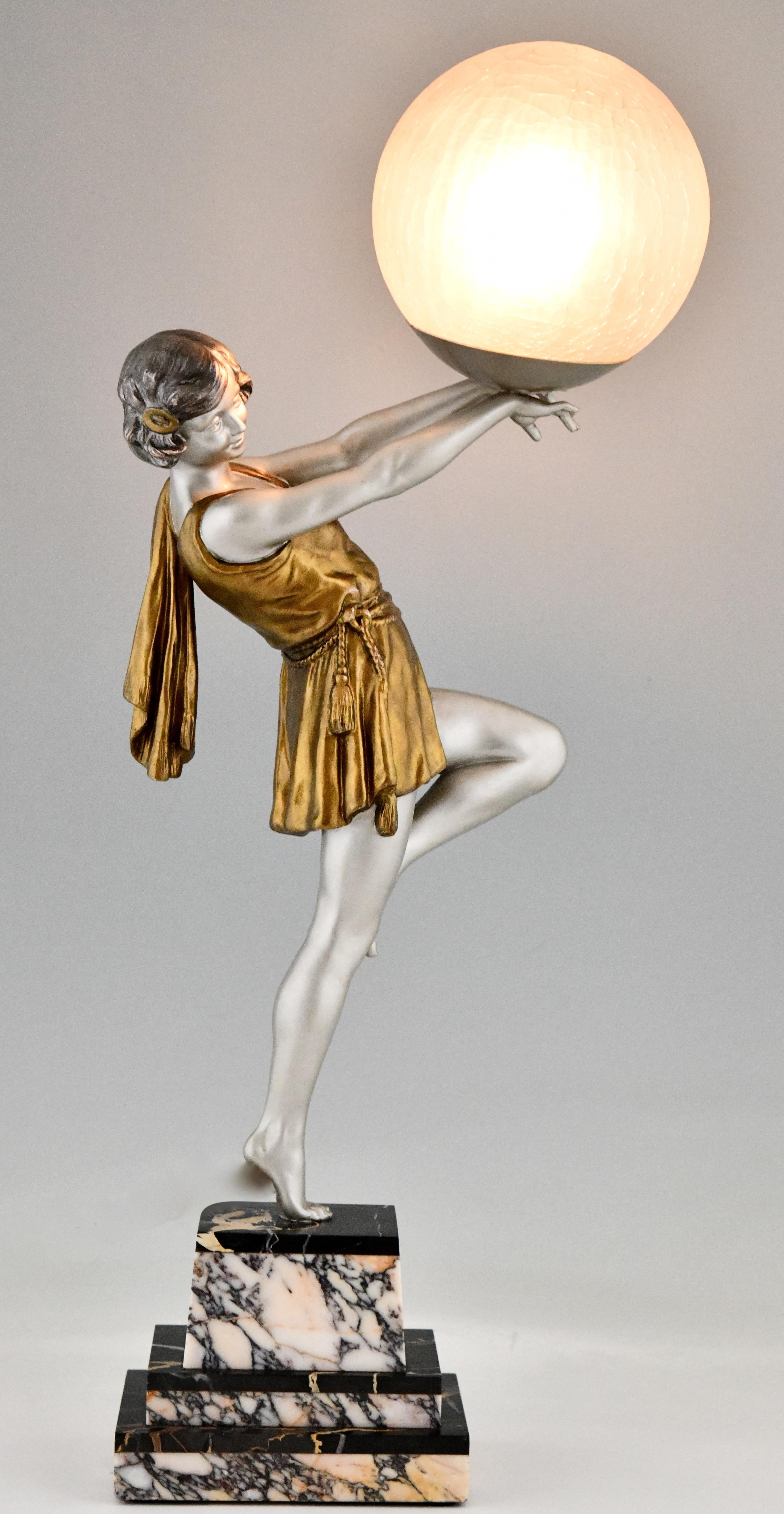 Art Deco sculptural lamp with lady holding a ball signed by the French artist Emile Carlier on a fine marble base, circa 1930.

This model (as sculpture) is illustrated on page 440 of the book?Bronzes, sculptors and founders by H. Berman,