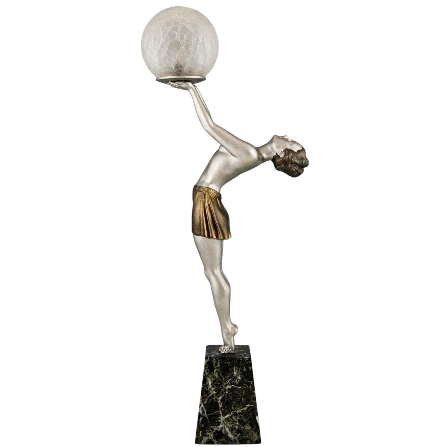 Art Deco lamp with semi-nude lady holding a glass globe signed by Enrique Molins Balleste. 
Patinated metal on a marble base. 
France 1930. 
US plug will be provide for immediate use. 
With Certificate of Authenticity. 
Information on the