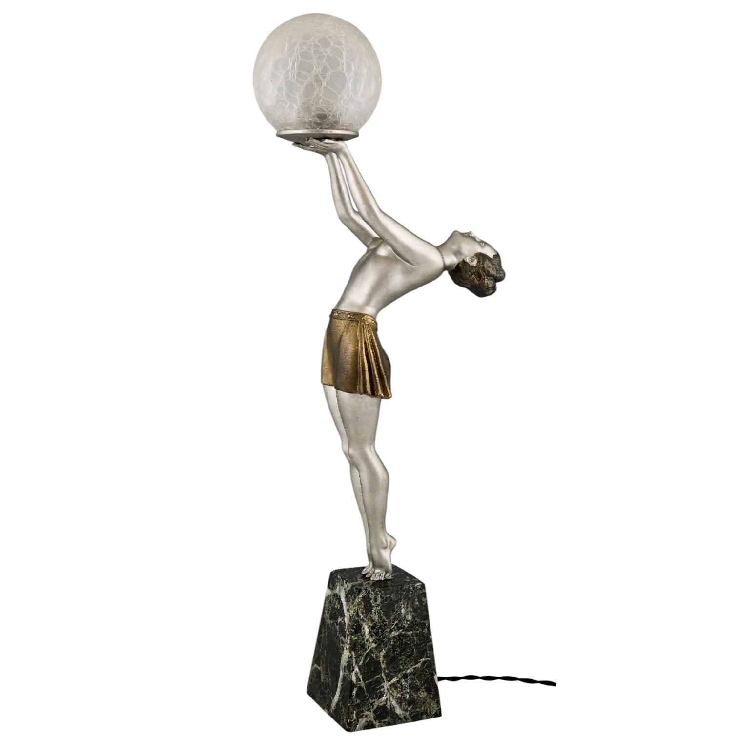 Patinated Art Deco lamp lady holding a glass globe by Enrique Molins Balleste, France 1930 For Sale