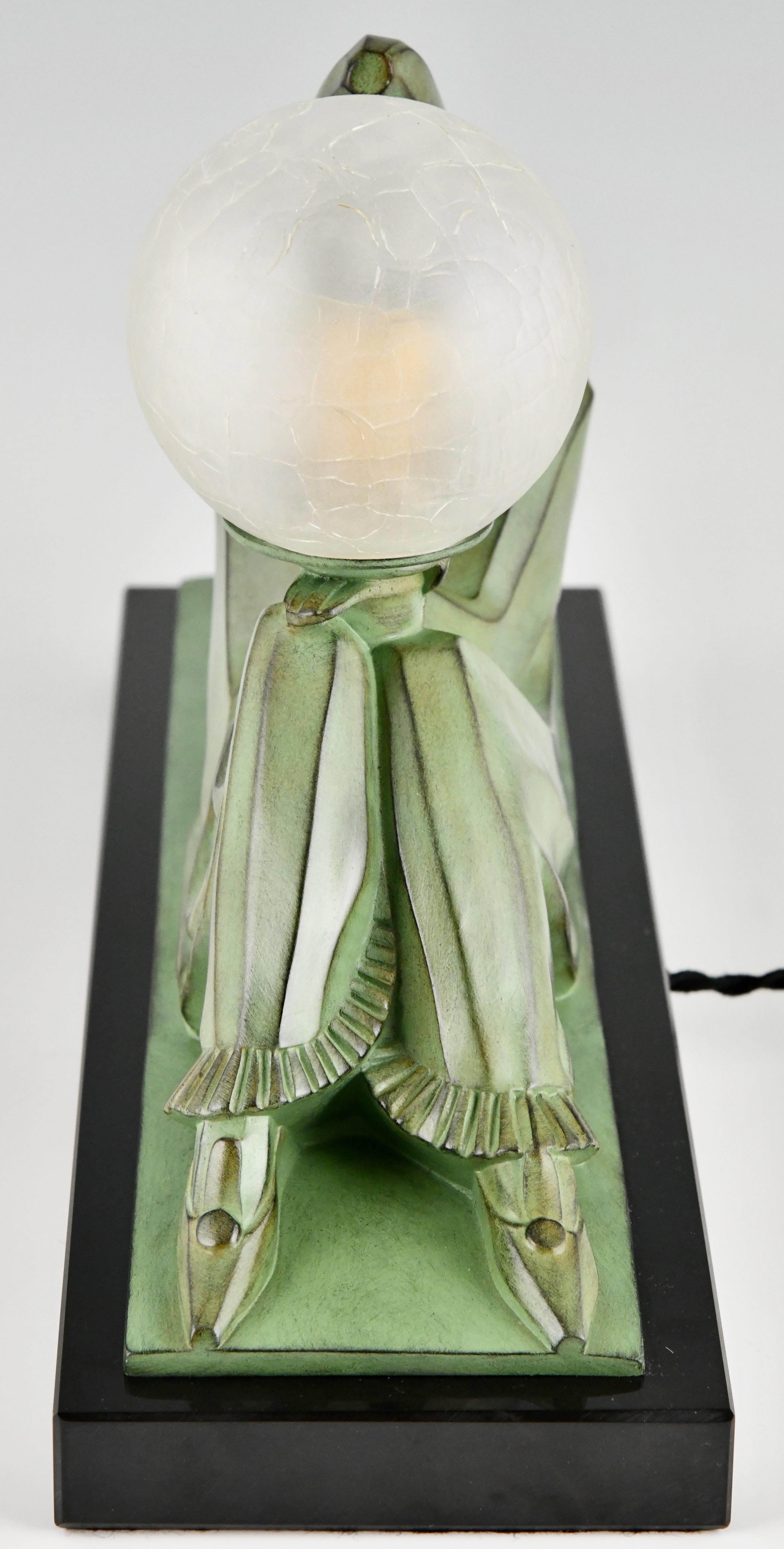 Patinated Art Deco lamp Pierrot with ball by Marcel Bouraine for Max le Verrier.  For Sale