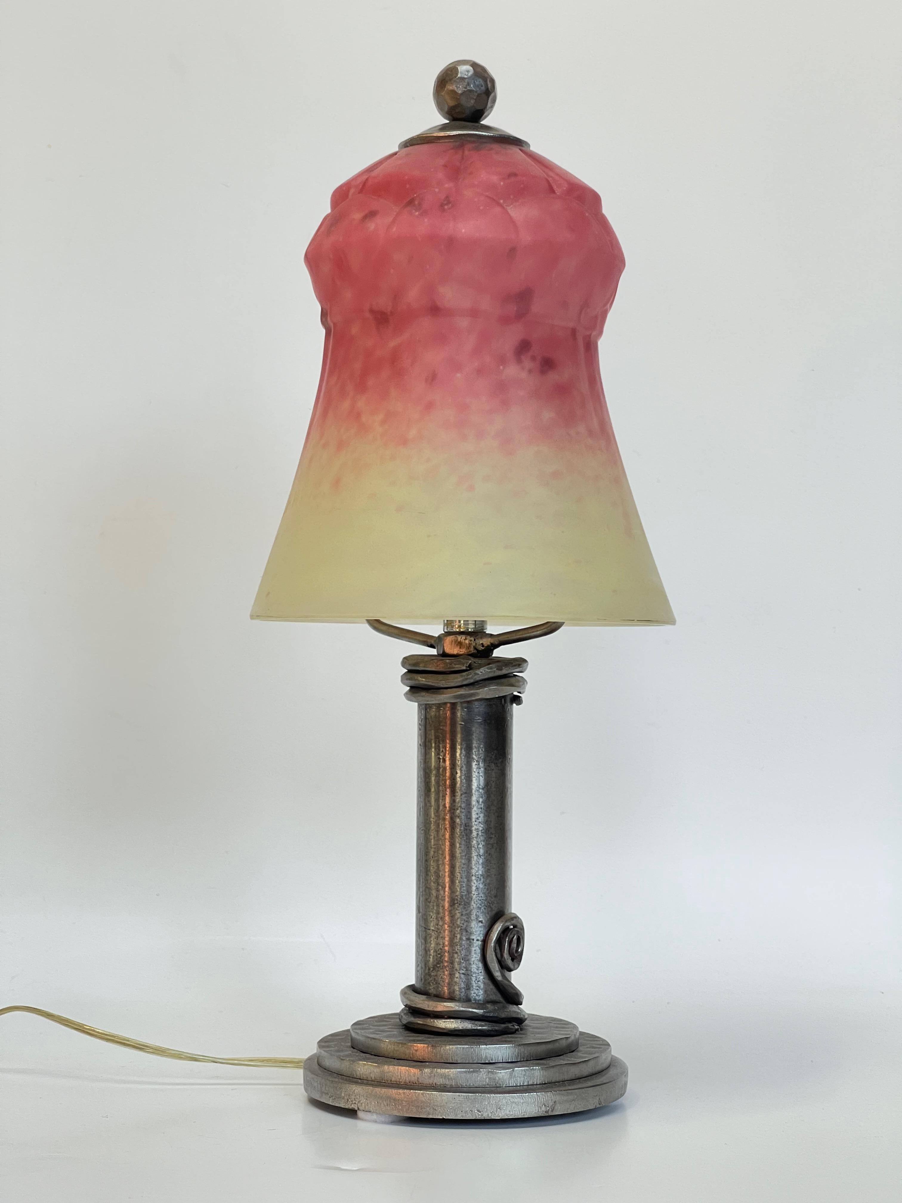 Lamp around 1930 wrought iron foot and tulip in molded blown glass paste signed Schneider in raspberry color and brown speckled cream the lamp is electrified and in perfect condition.
The signature is impossible to photograph. It is visible against