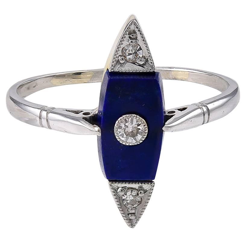The slender Marquise shaped top, set with a thick Lapis plaque which is centrally mounted with a Diamond in a milligrain edged Platinum setting, with a further Diamond in Platinum at either end.
The reverse of the head is in 18k Gold to a Platinum