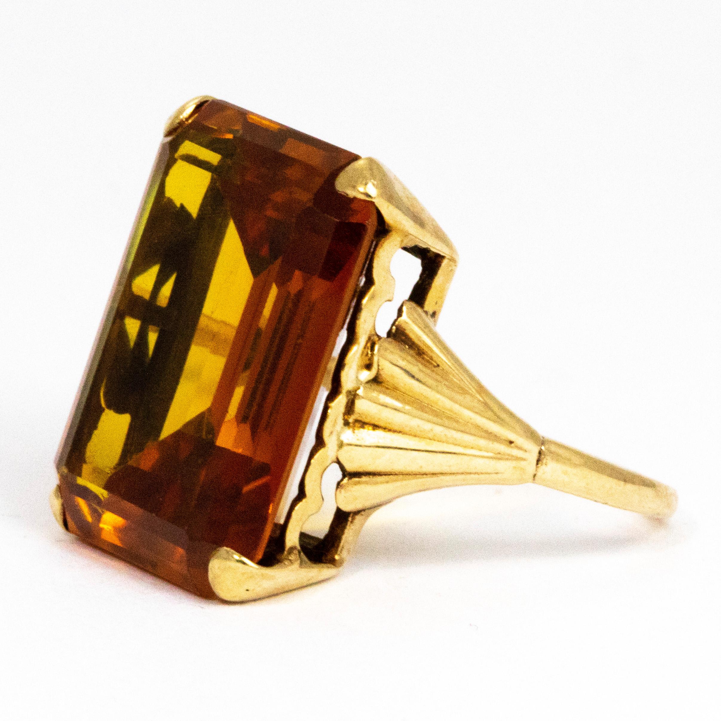 The deep amber colour of this citrine is gorgeous. The colour of the stone next to the 9ct yellow gold truly make a match made in heaven! Held by a simple claw setting the citrine is emerald step cut and the light reflects beautifully. This ring