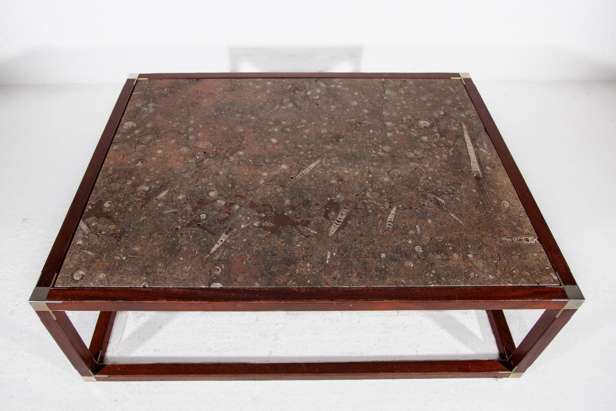 Art Deco very nice one-off large with 40 Million year old fossil stone top coffee table, 1930s. This table has a spectacular sculptural fossil stone top, in very deep brown, grey and soft red earth colors full of fossils. It has a very nice white