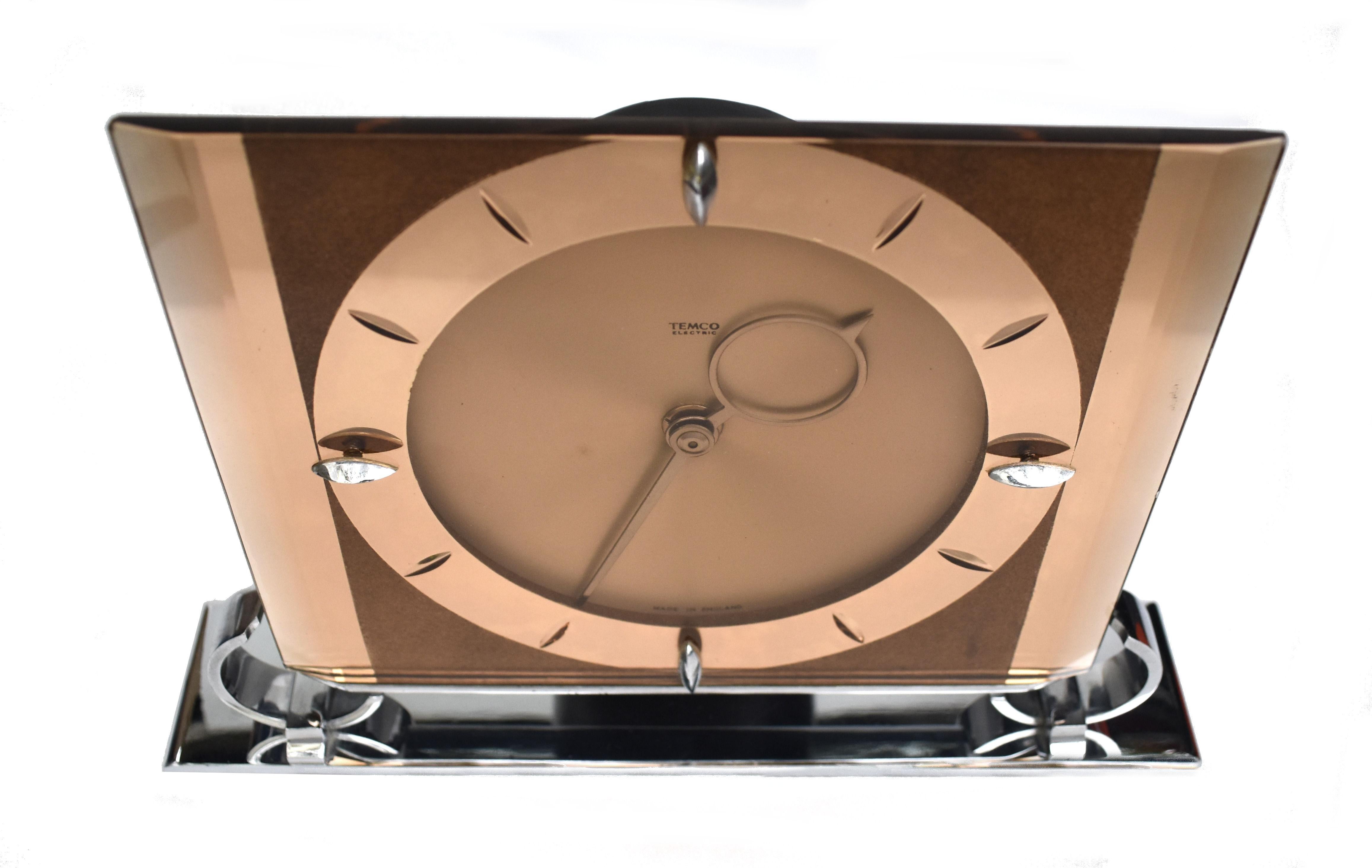 For your consideration is this very stylish large copper coloured glass & chrome frame Art Deco Clock. Remarkable condition for it's age is this totally authentic 1930s Art Deco style mirror clock which originates from England. Made by clockmakers