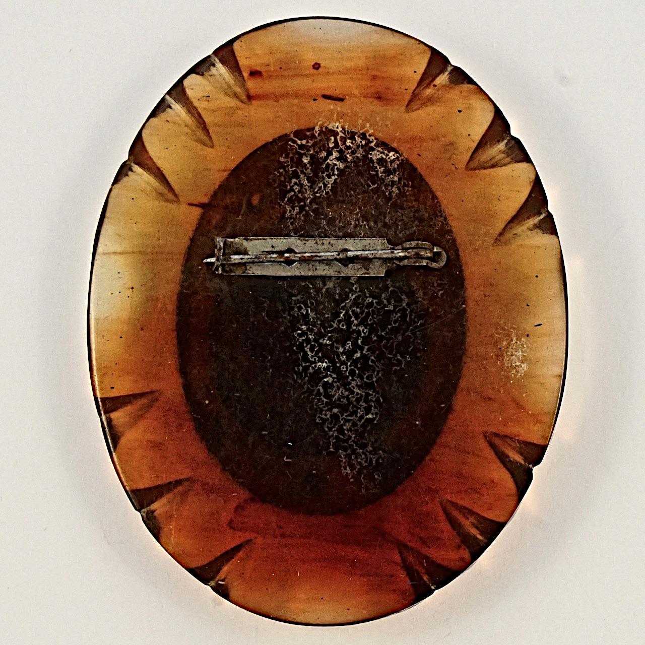 Women's or Men's Art Deco Large Early Plastic Oval Black and Amber Cameo Brooch For Sale