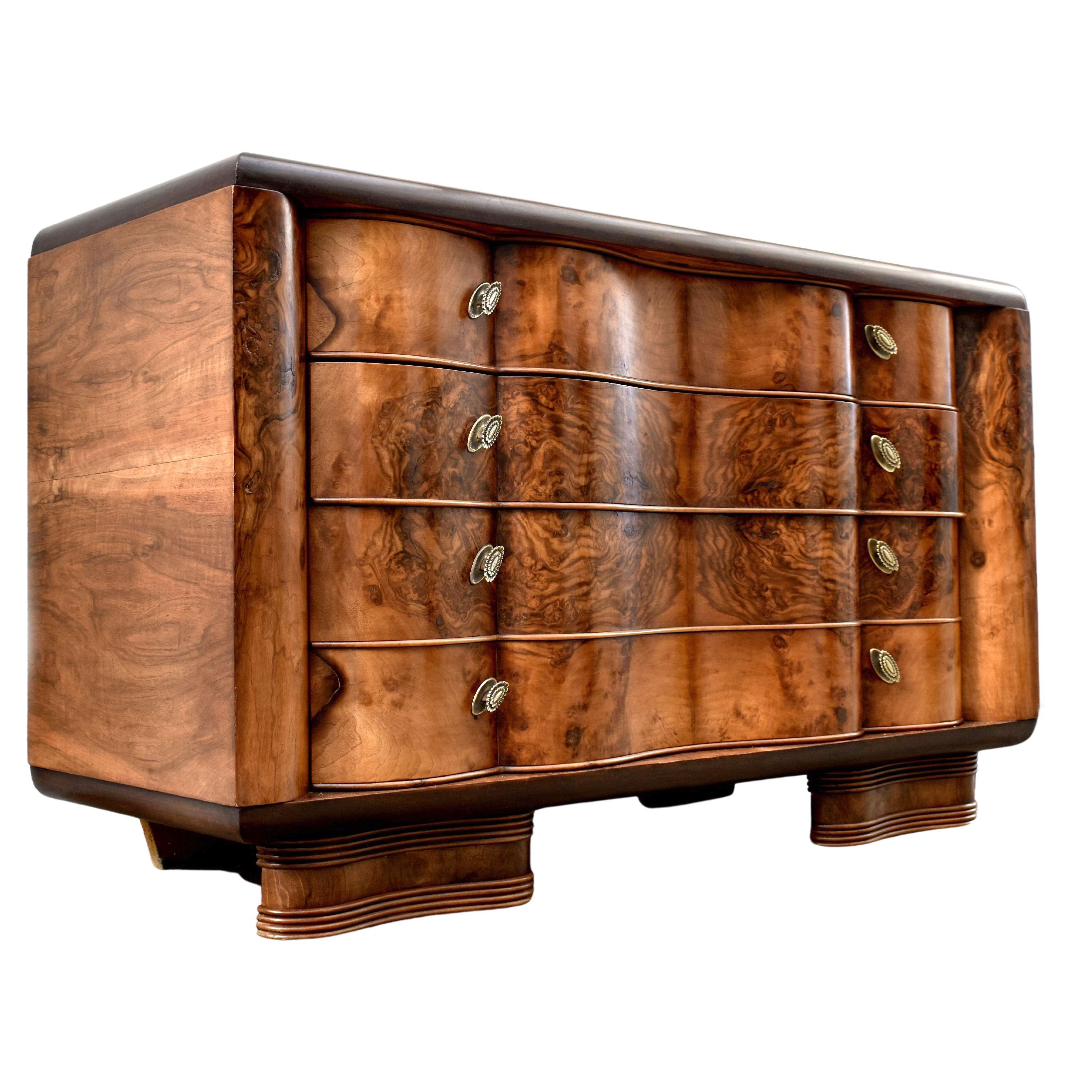 For your consideration is this superbly stylish Art Deco Italian walnut chest of four drawers dating to the 1930's. It has stunning walnut veneers and great original Art Deco handles in silvered metal. On first viewing these drawers are an