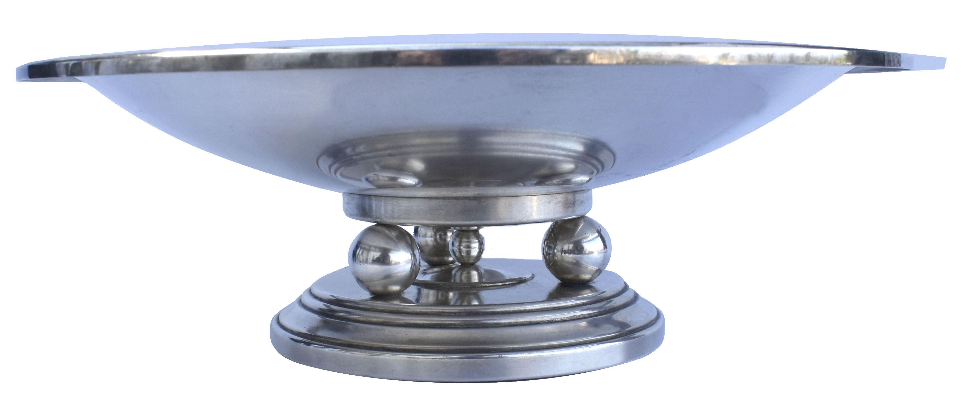Superbly stylish large Art Deco chrome plated modernist coupe /comport dating to the 1930's and originating from France. The design is a simple circular dish which has three circular chrome balls underneath which act as the column between base and