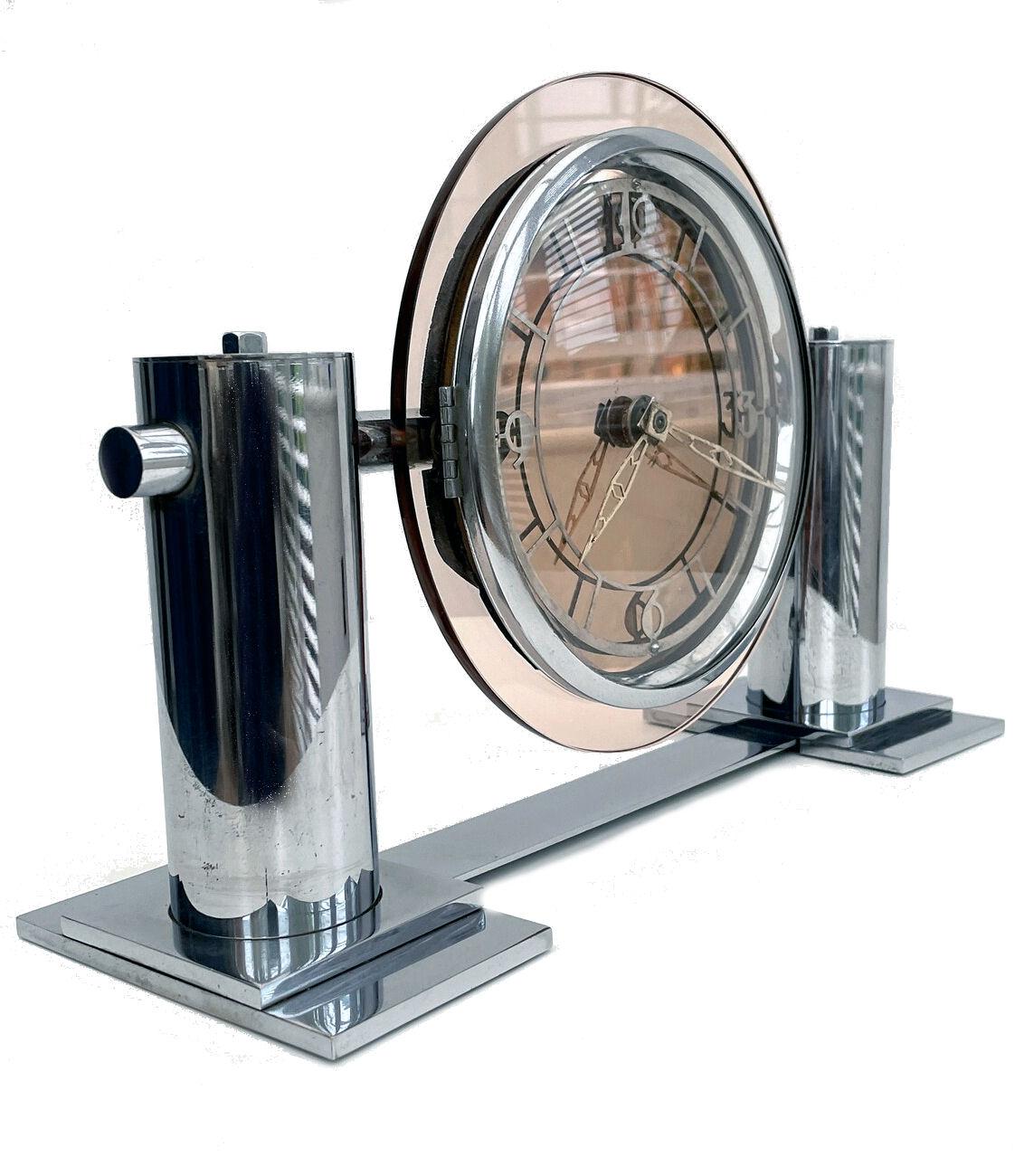 For your consideration is this Impressive 1930's modernist mantle mirror clock, no makers name and sourced in England. This clock is quite large , see dimensions and so has a real impact not just by how attractive it is but also by it's size. In