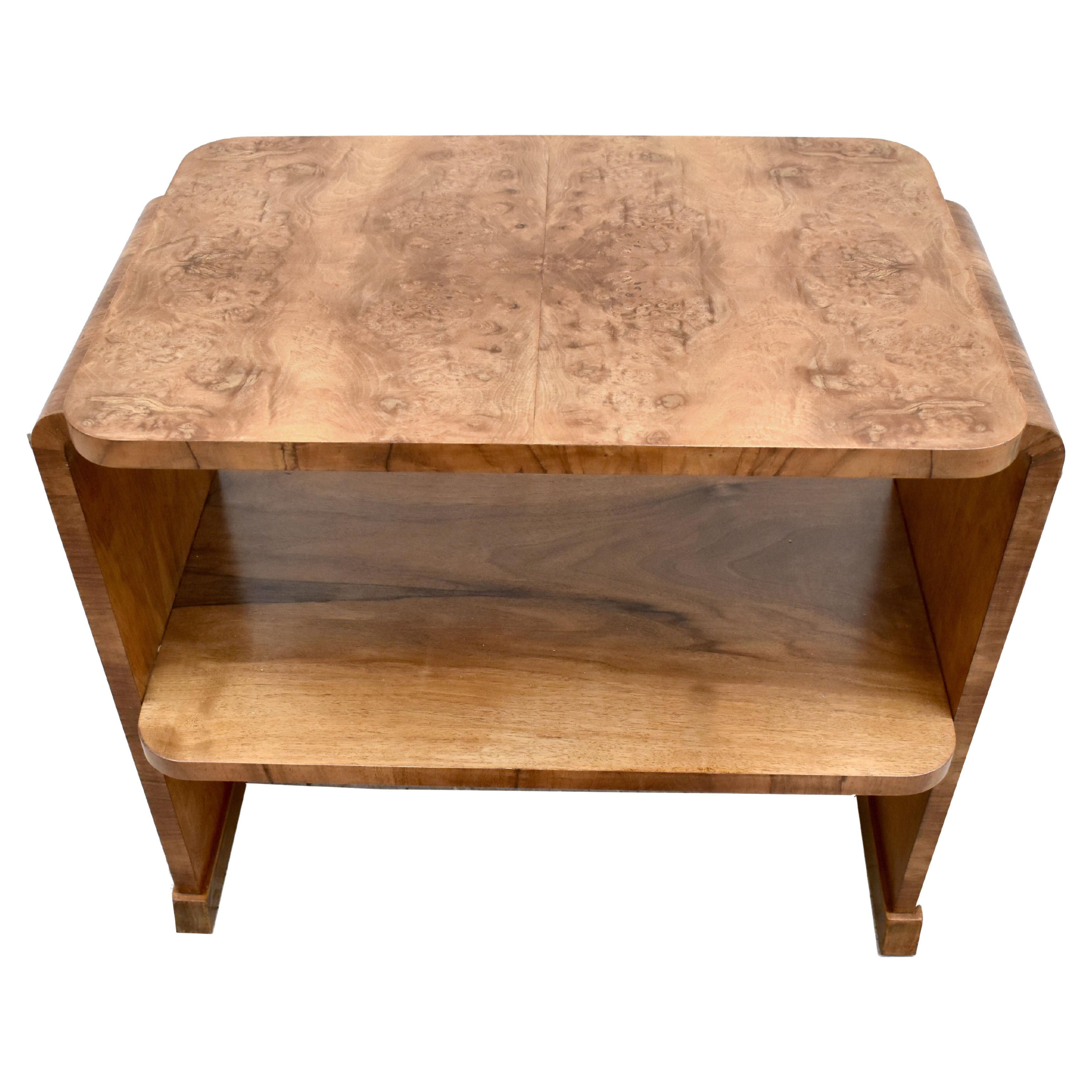 Exceptional quality Art Deco burl walnut honey tone occasional table dating to the 1930s. Superb shape and really good size for modern day use. Two tier so ideal for using as a book or magazine table. Very sturdy and solid piece of furniture. We've