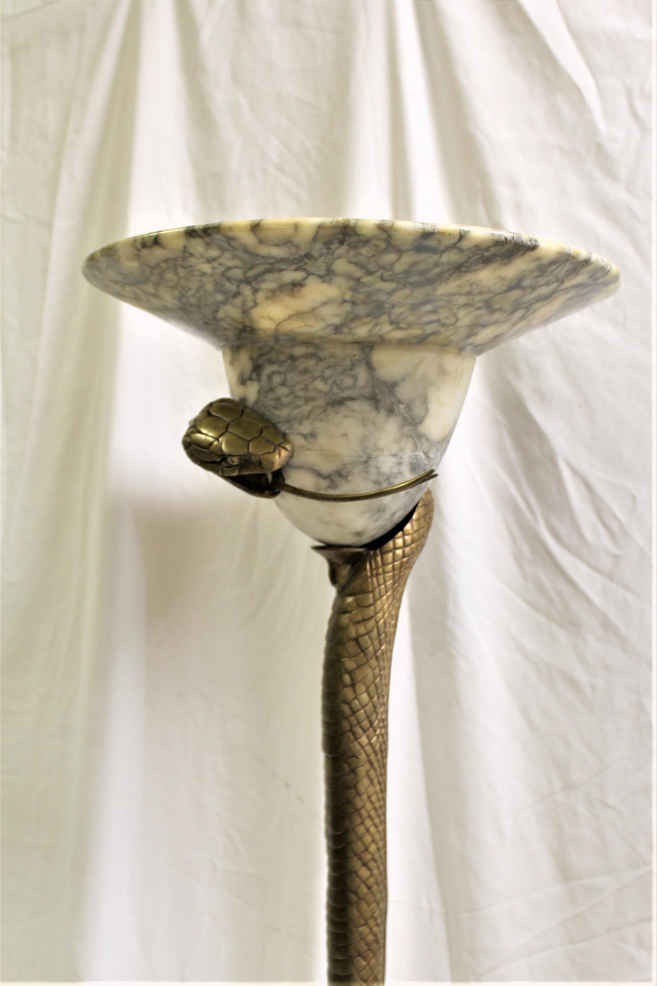 This is the most popular Snake floor lamp designed by E. Brandt. A contemporary cast in bronze with a golden polished patina finish. Hi detailed casting with an older rare Alabaster shade from France. There are none like it around. Heavy and will