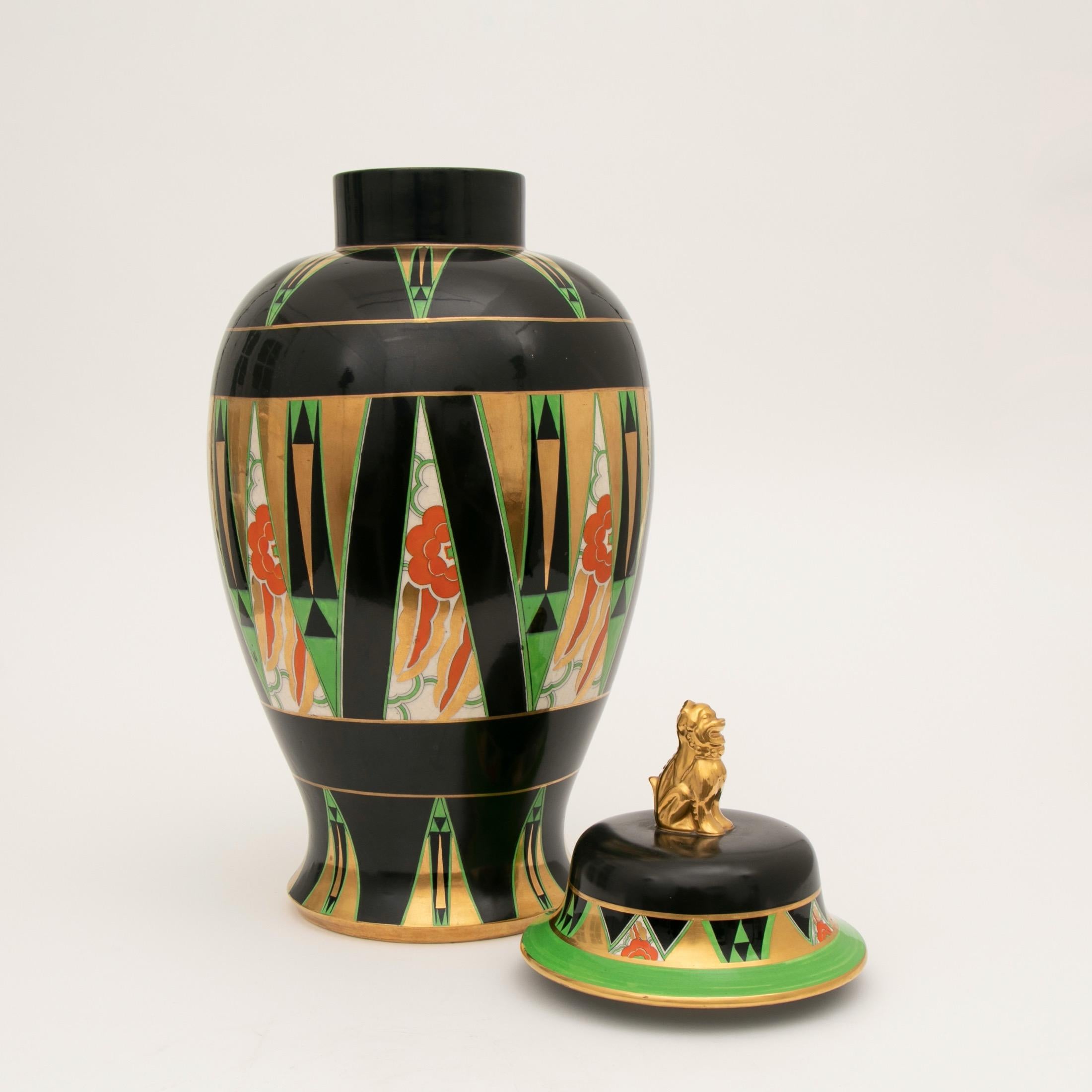 A rare Art Deco temple vase with a foo fu dog finial lid designed by Enoch Boulton and produced as an exhibition piece. The vase is decorated with black, green and orange enamel and 22-carat gold.
Enoch Boulton designed this Orient pattern to lead