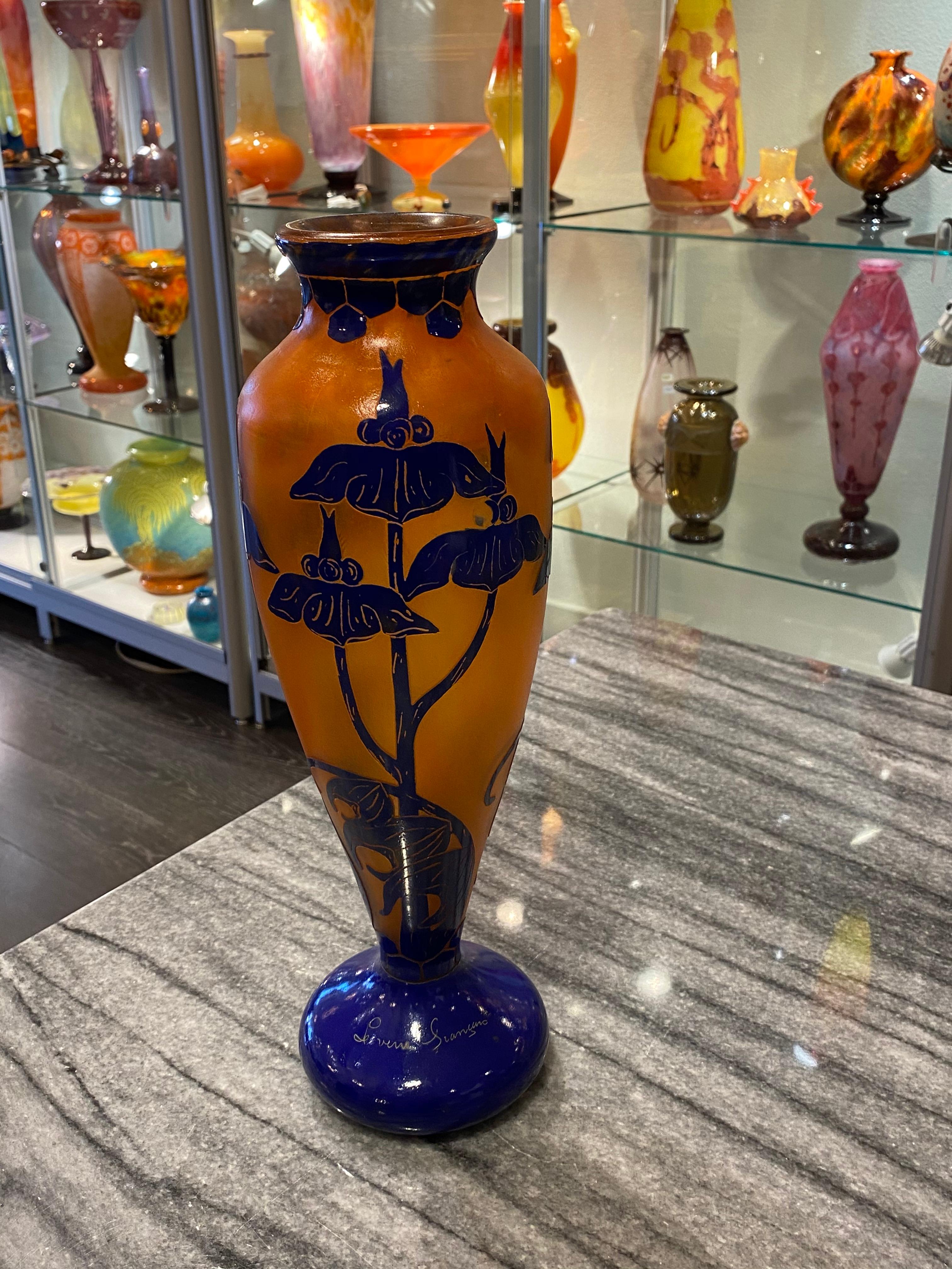 Art Deco cameo glass by Le Verre Francais (Charles Schneider) in the pattern called Solaneé, orange color and overlay by cobalt blue carved glass.
Made in France
Signature: Le Verre Françias.
  