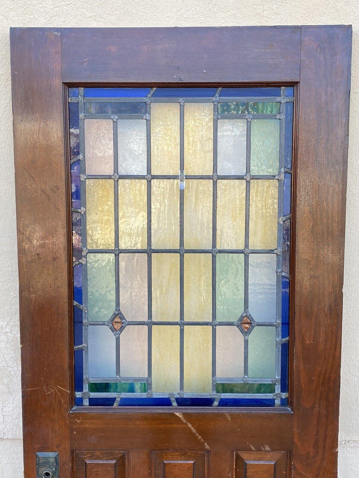 Antique Art Deco Leaded Stained Glass Wooden House Front Door Pink Blue Yellow Green. Item features a wonderful pink, green, blue, and yellow Art Deco stained glass, solid wood frame, original antique item, great style and form. Circa Early