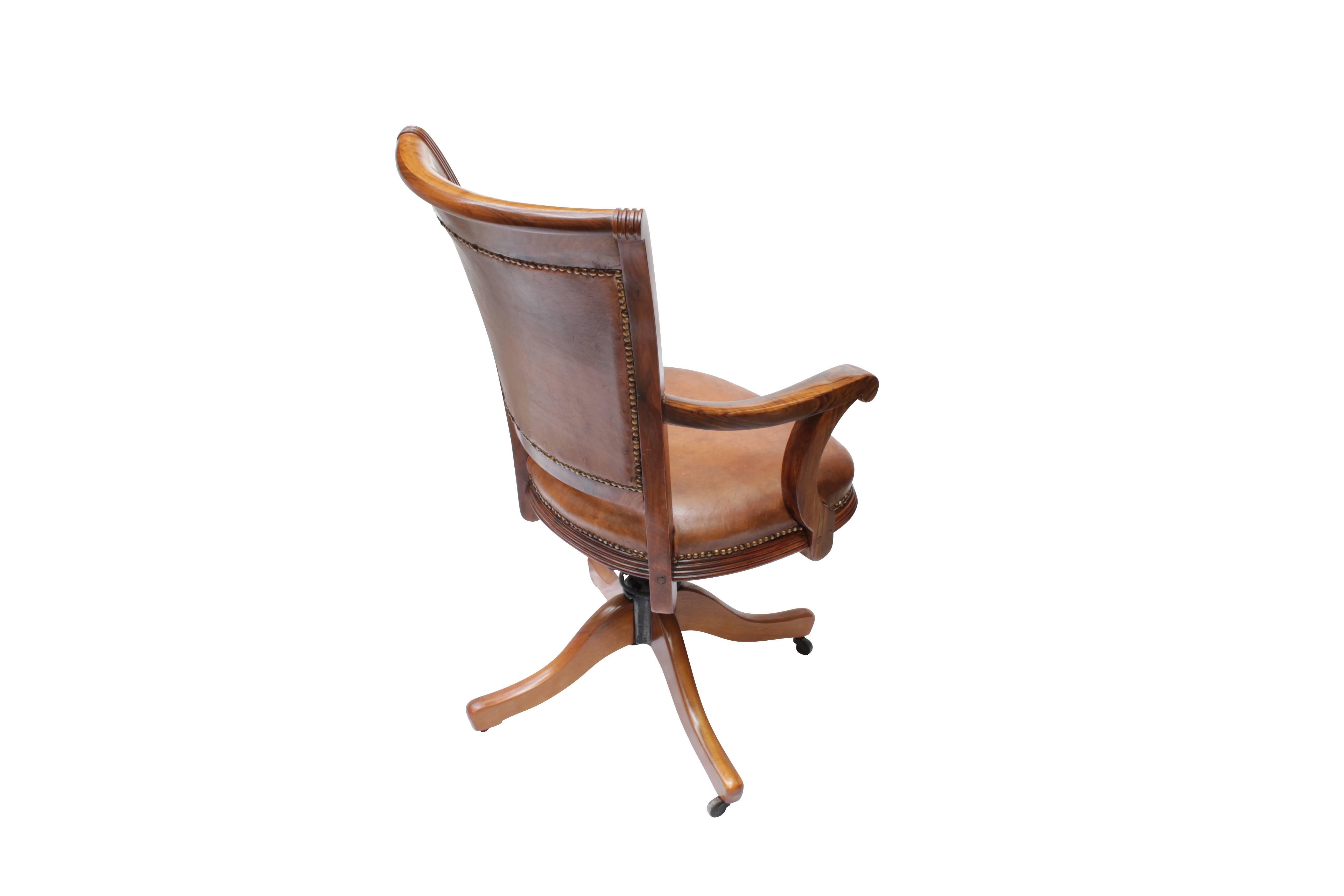 Well restored Art Deco office armchair with hand patinated sheepskin re-upholstered. The chair is made of solid walnut and is adjustable in height, rotatable and tiltable backwards.

Dimensions:
Seat height 52, 61 cm
Height 101, 110 cm
Width 58