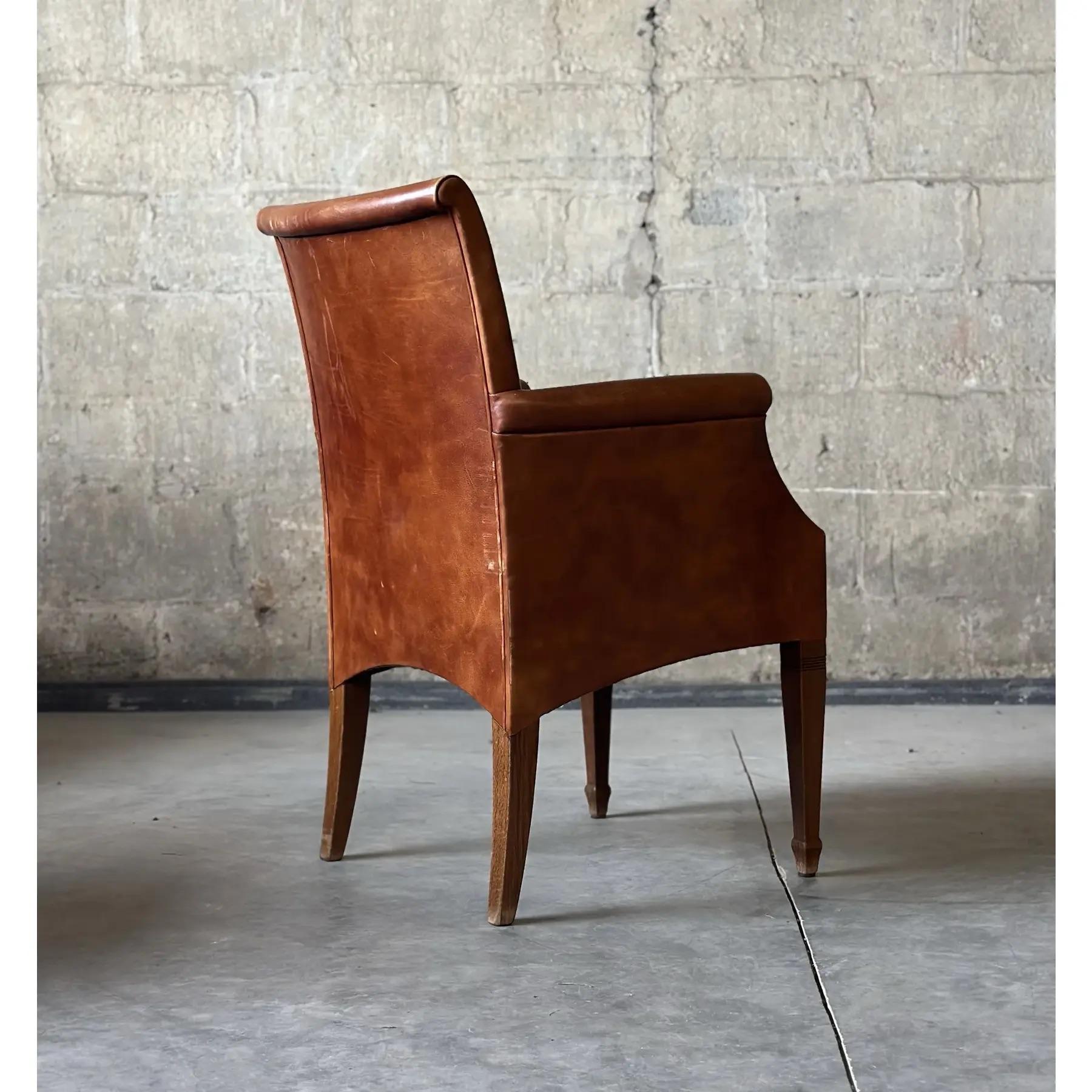Stunning Leather Dining Chair from the Art Deco period. Gorgeous cognac colored leather with the perfect amount of patina. Straight wood legs create a clean and simple look to finish these off.