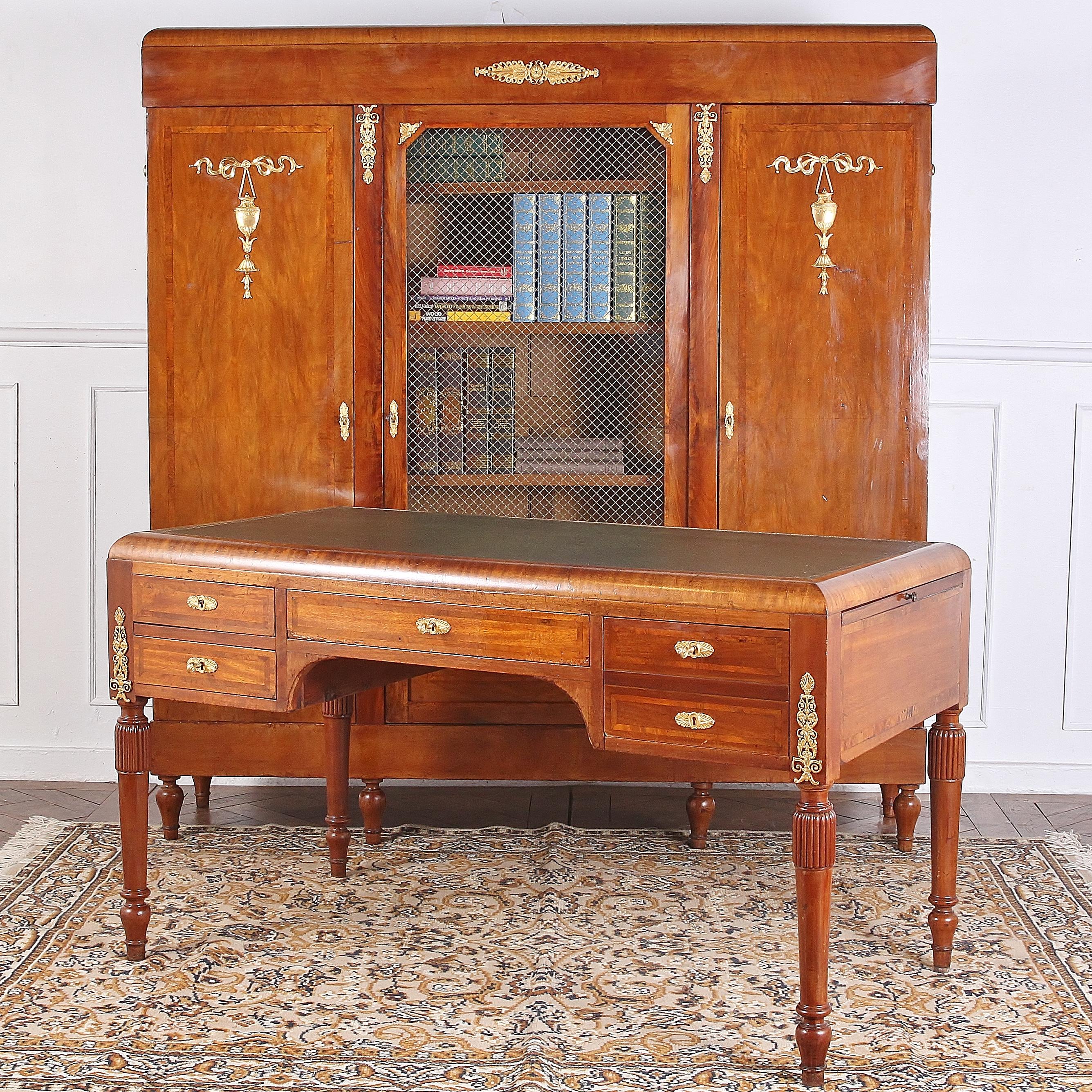 Very functional green leather-top office desk, with ormolu mounts and four drawers for storage, in which one of the drawers has a hidden storage space and a key and lock to access. 



 