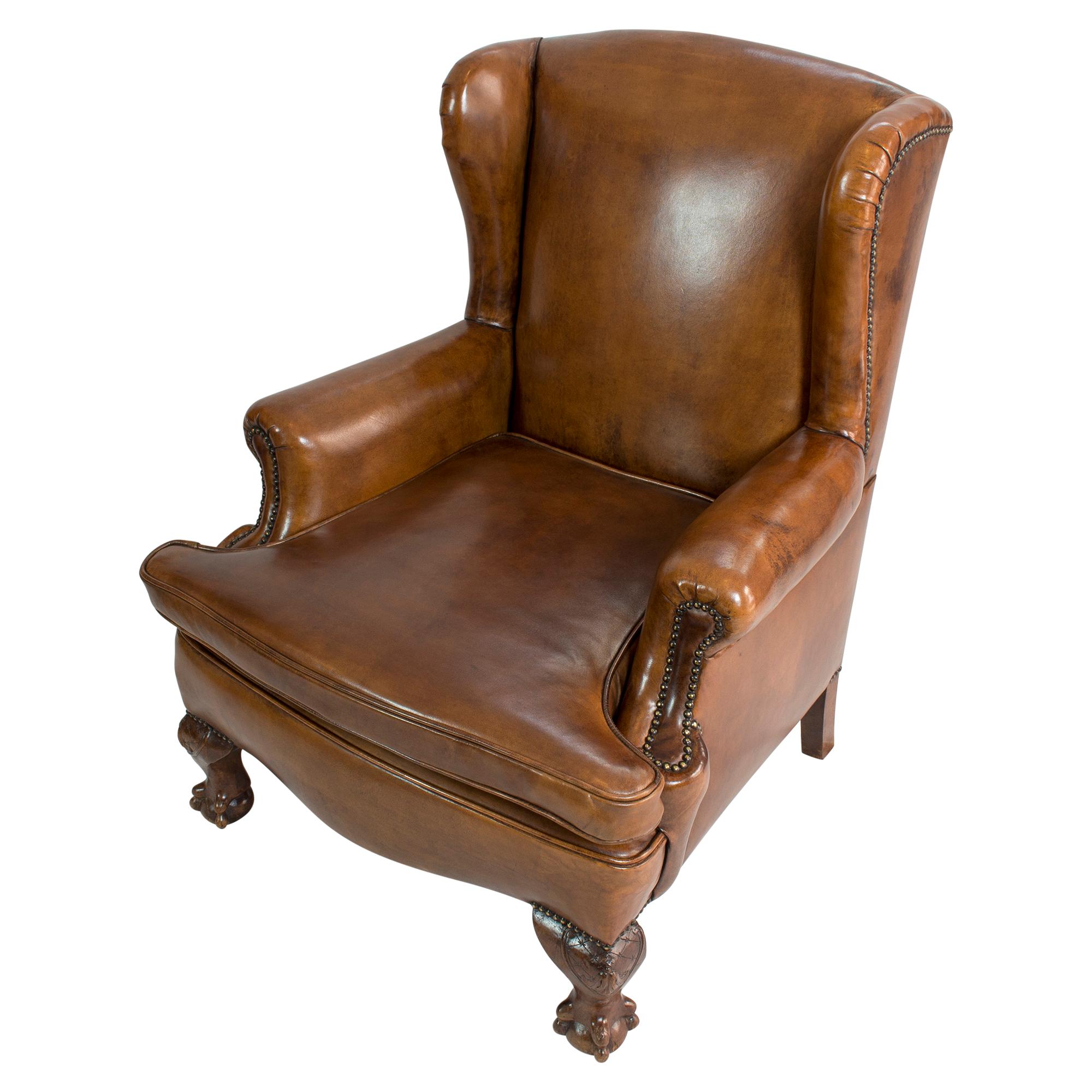 Patinated Art Deco Leather Wingback Armchair For Sale