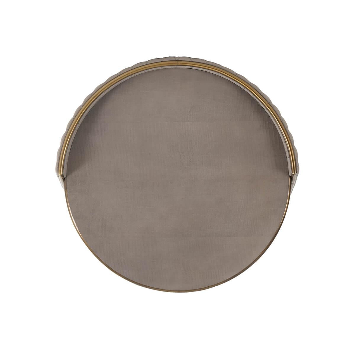 Crafted with a circular grey fiddle back sycamore top and undertier, adorned with a bronze finish molding. Its geometric quilted leather-wrapped 'collar' support adds a touch of sophistication, complemented by similar molding for a cohesive