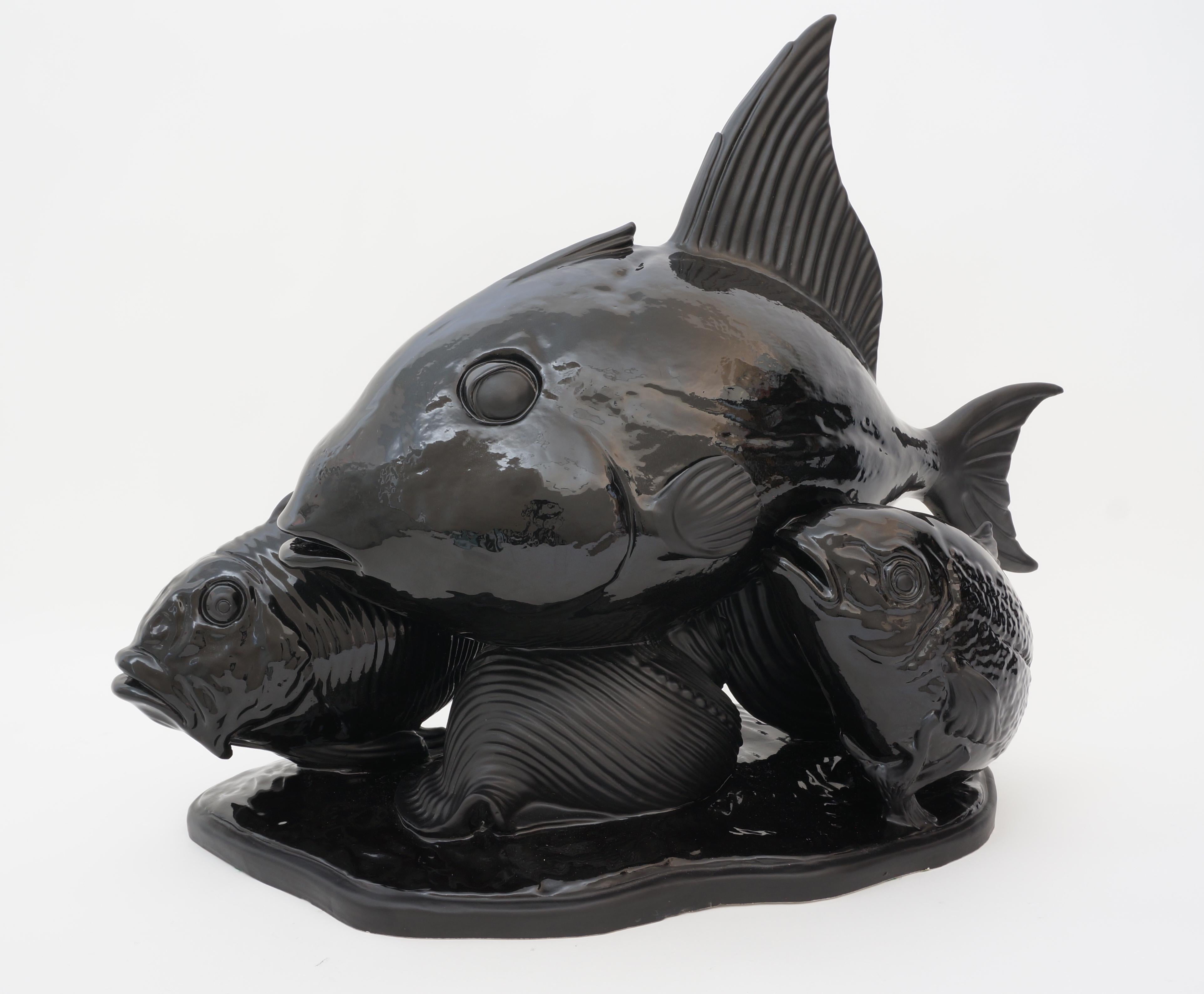 This stylish and chic Italian sculpture of a school of fish had taken its inspiration of the Art Deco period and of pieces by the designer Lejan.

Note: The piece is molded ceramic and is finished in a matte and high gloss black glaze. 
