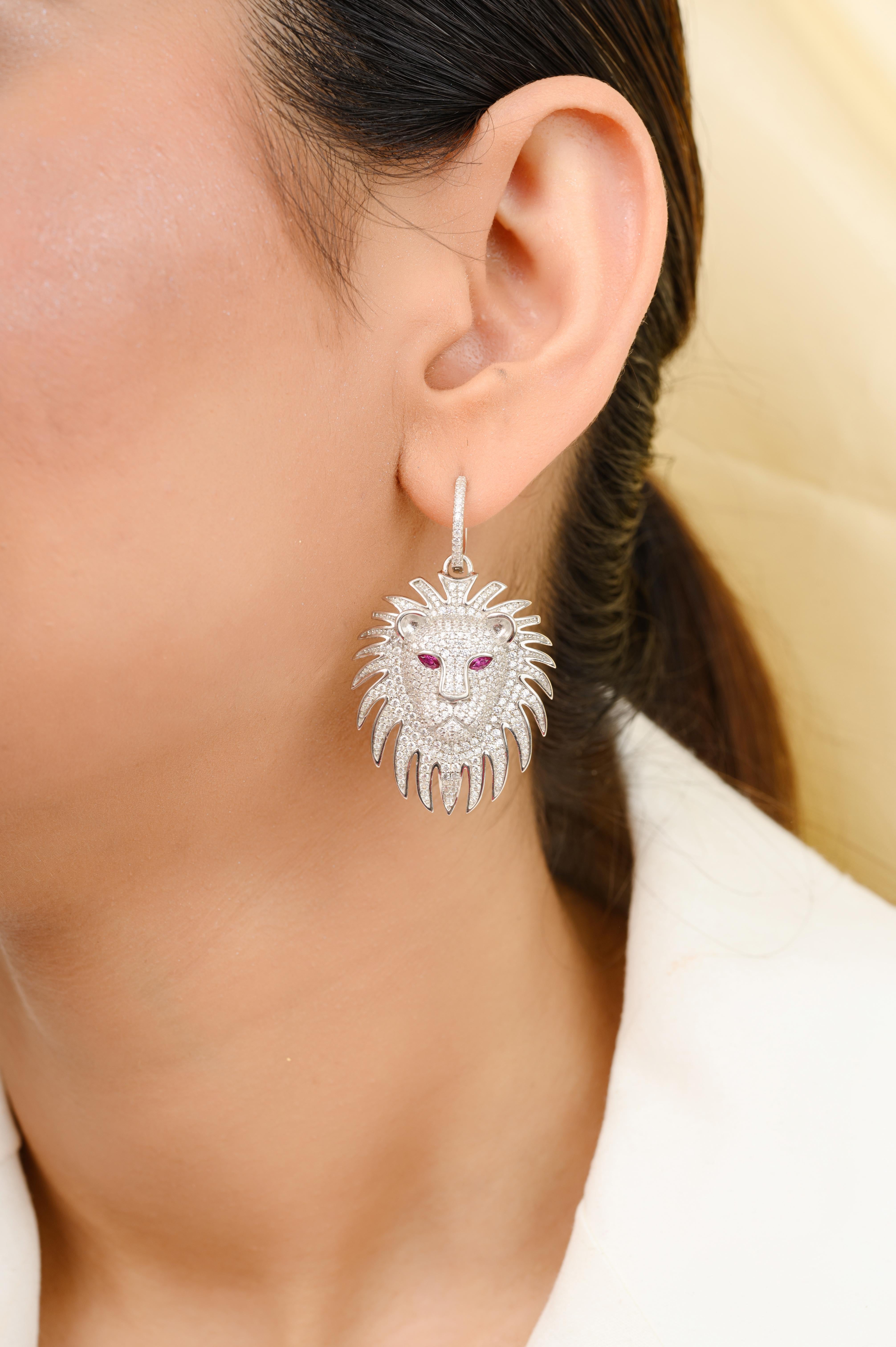 Art Deco Style Leo Lion Charm Rhinestone Hoop Earrings in sterling silver. You shall need these hoop earrings to make a statement with your look. Each piece features dazzling cubic zirconia stones, renowned for their brilliance and clarity, set in