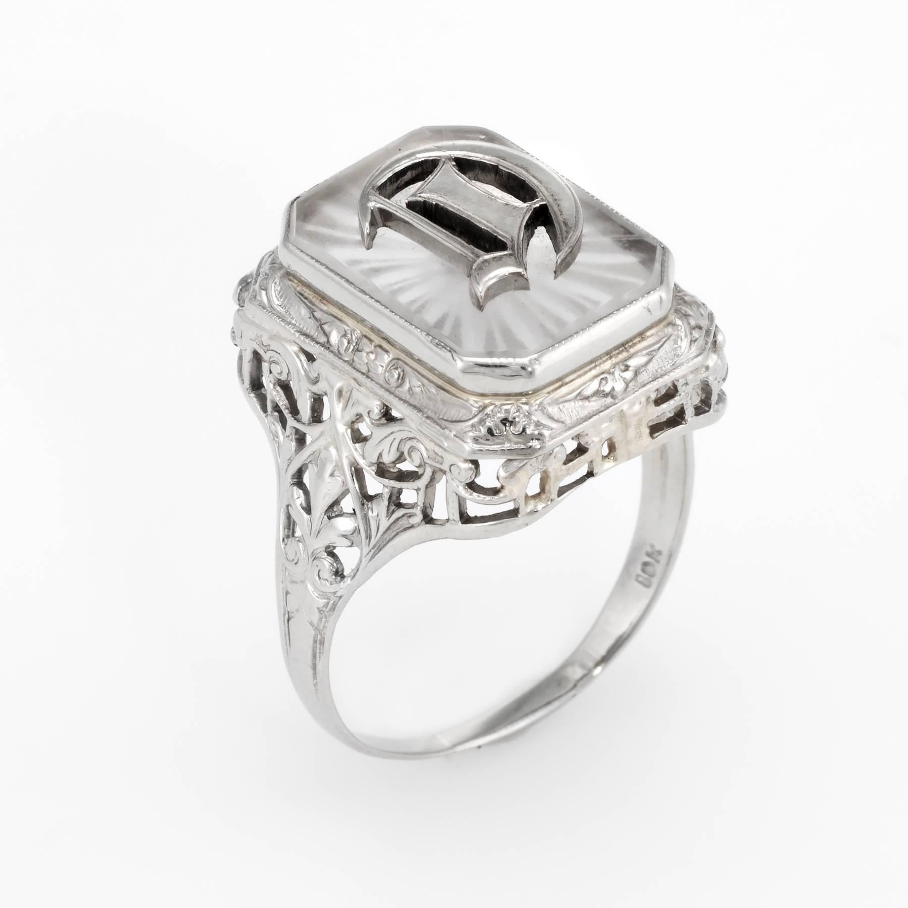 Finely detailed vintage Art Deco era ring (circa 1920s to 1930s), crafted in 10 karat white gold. 

Centrally mounted rock crystal measures 13mm x 10mm. The underside of the rock crystal is etched in a star formation. 

The letter 