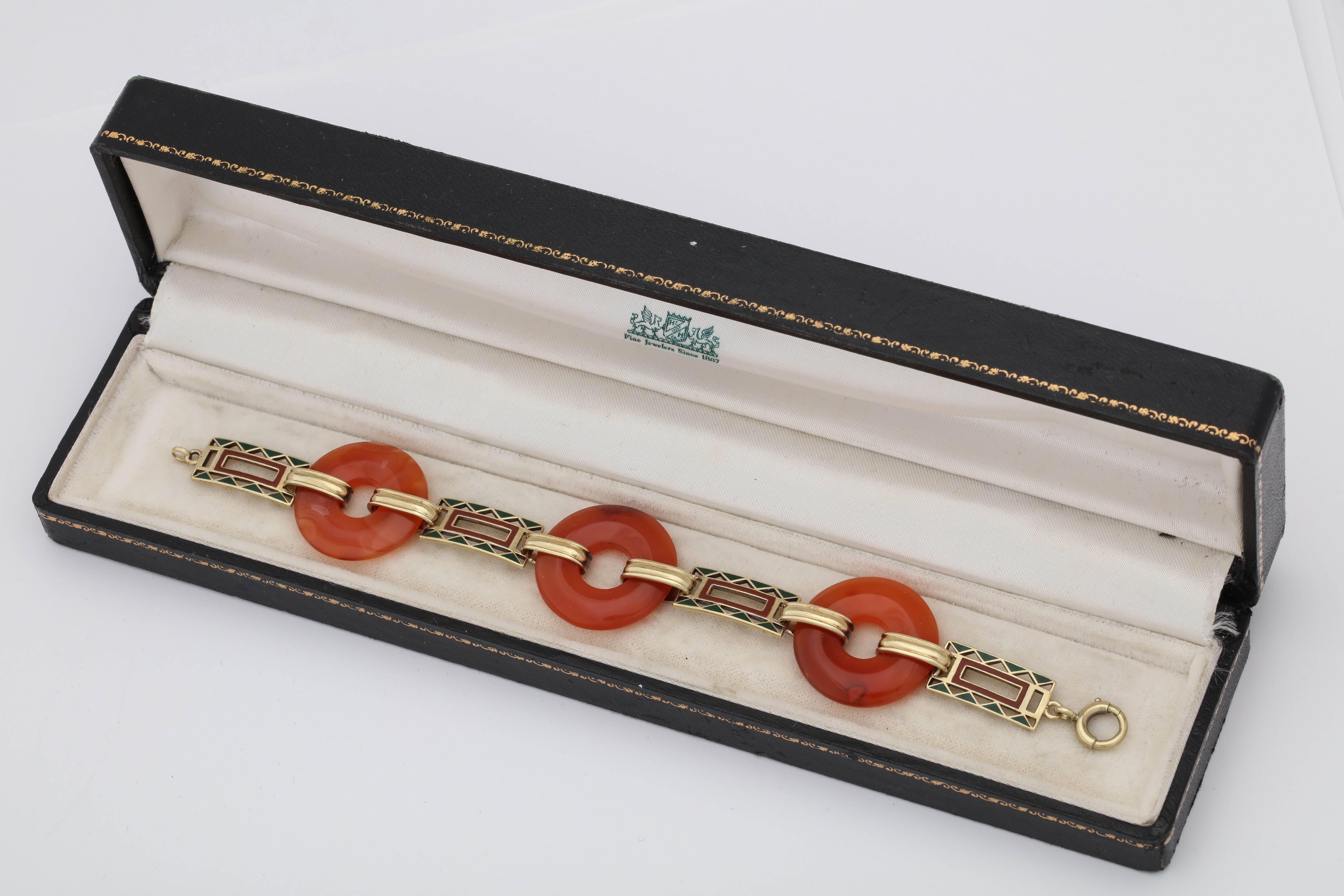 One Ladies  Art Deco 14kt Yellow Gold Link Bracelet Designed With 3 Custom Cut Lifesaver Shape Round Carnelian Stones. Further Designed With Four Geometric Shaped Rectangular Links Embellished With Orange And Green Hand Applied Hard Enamel.This