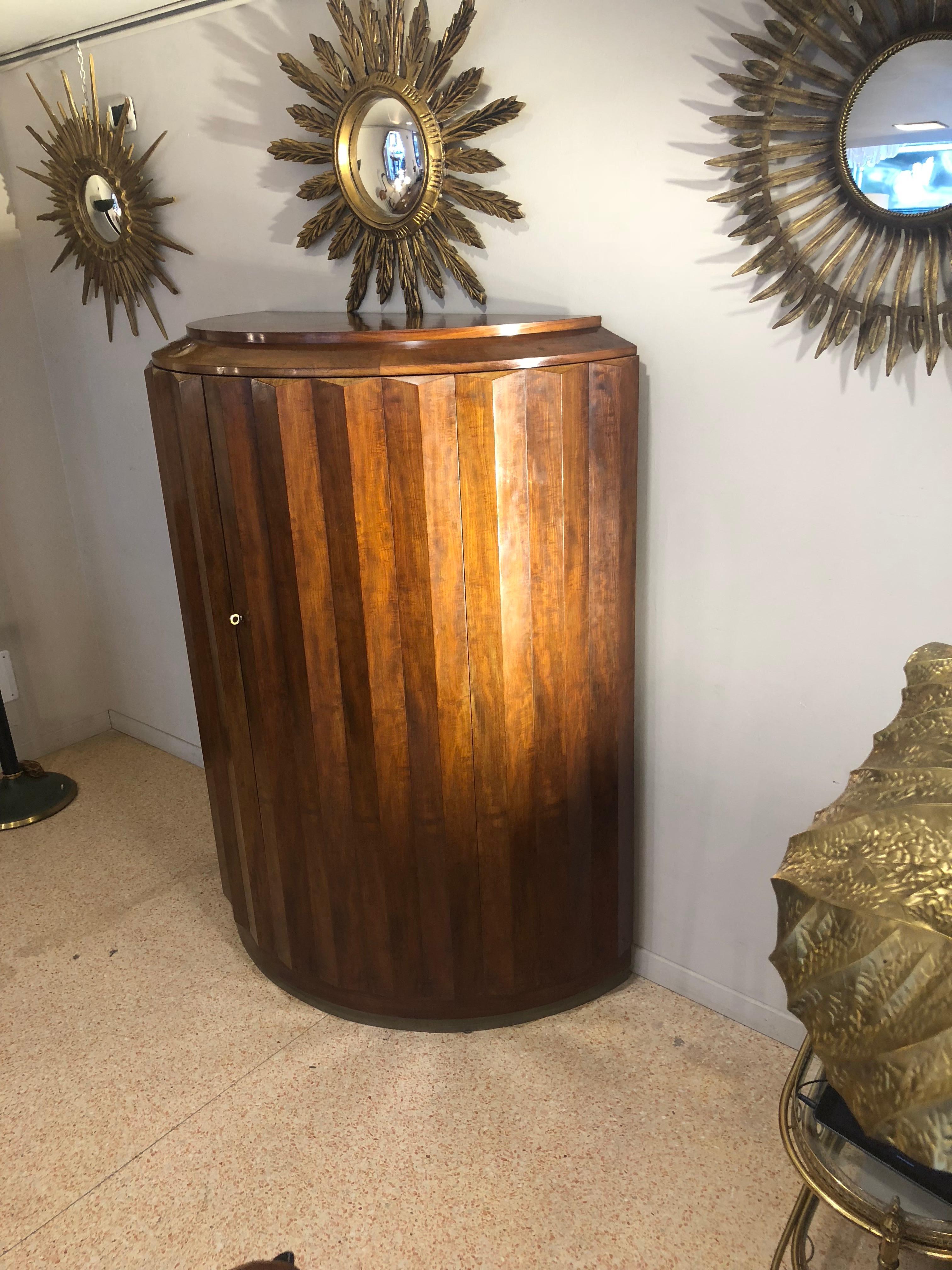 Geometrical shape half moon mahoganywood cabinet, from 1930 Art Deco period showing the signature Ruhlman inscribed on the back. Two doors open on a series of half moon shape shelves, original hardware ( keys and lockers). The base, which is
