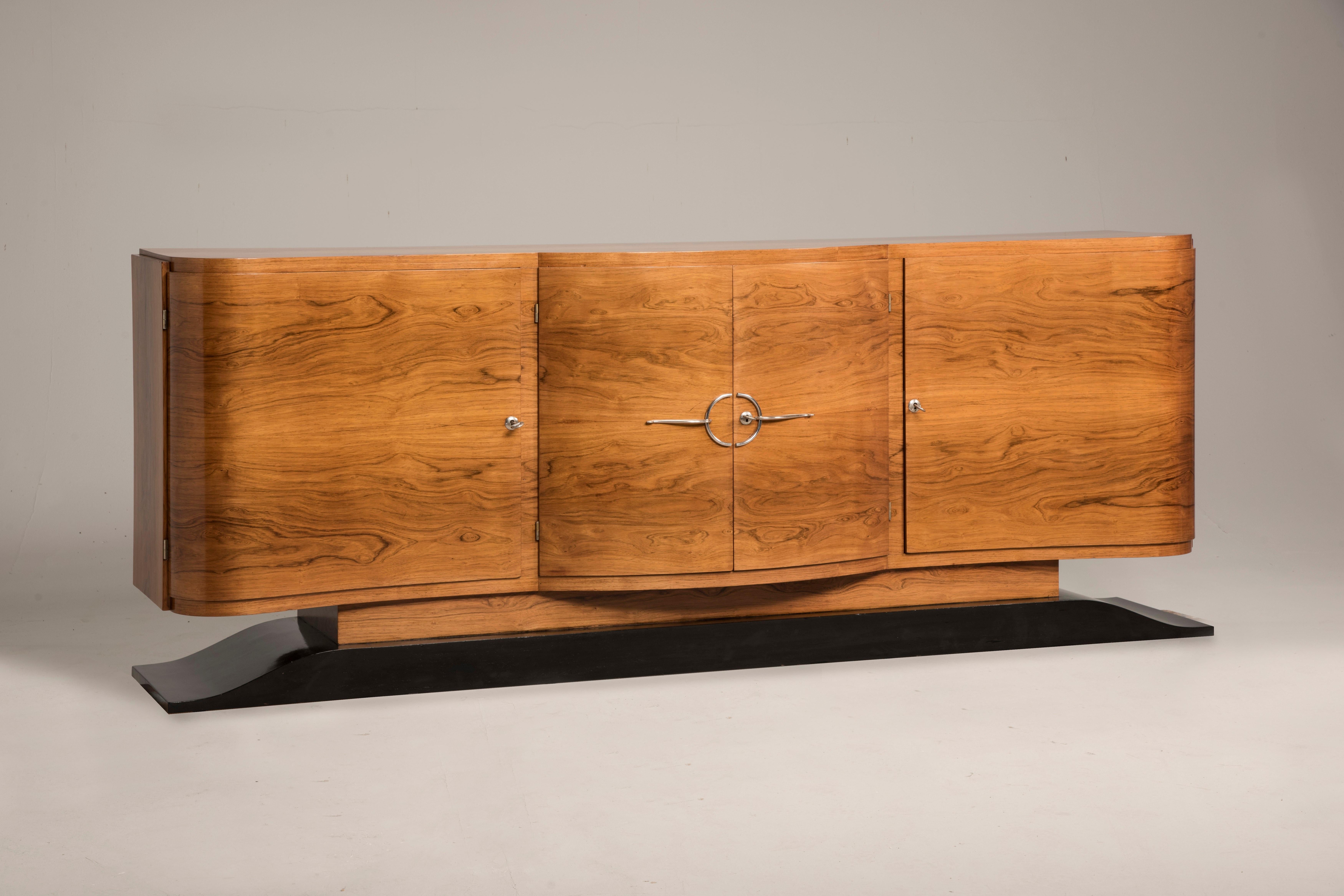 Art Deco Curvilinear sideboard from France from early 20th century 1930s. This credenza is very big and its storage capacity is huge. You will find two drawers and several shelves that can be adjusted based on your necessity. This credenza has been