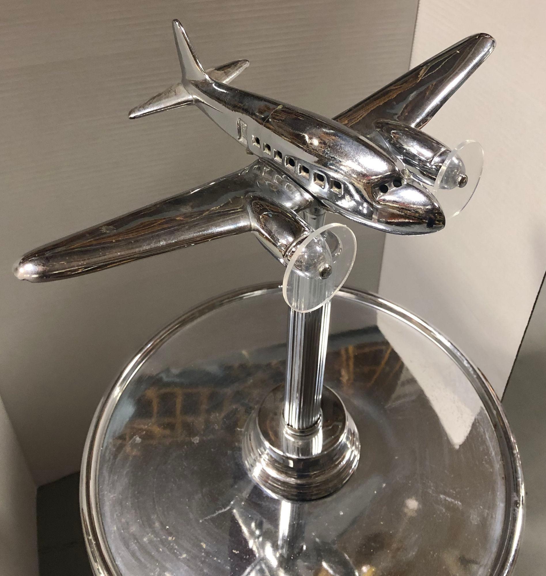 The Art Deco chrome lighted ashtray stand lamp epitomizes 1920s luxury and functionality. This dual-purpose piece boasts a geometric chrome design, blending elegance and practicality. With its integrated lighting and ashtray, it's a stylish