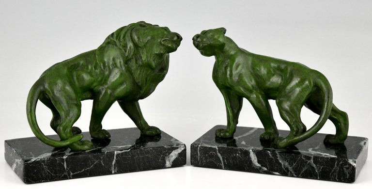 Art Deco lion bookends by the French artist Emile Carlier. Green patinated metal on a green marble base. France 1930. 
Literature:
Art Deco sculpture by Victor Arwas, Academy. Bronzes, sculptors and founders by H. Berman, Abage.