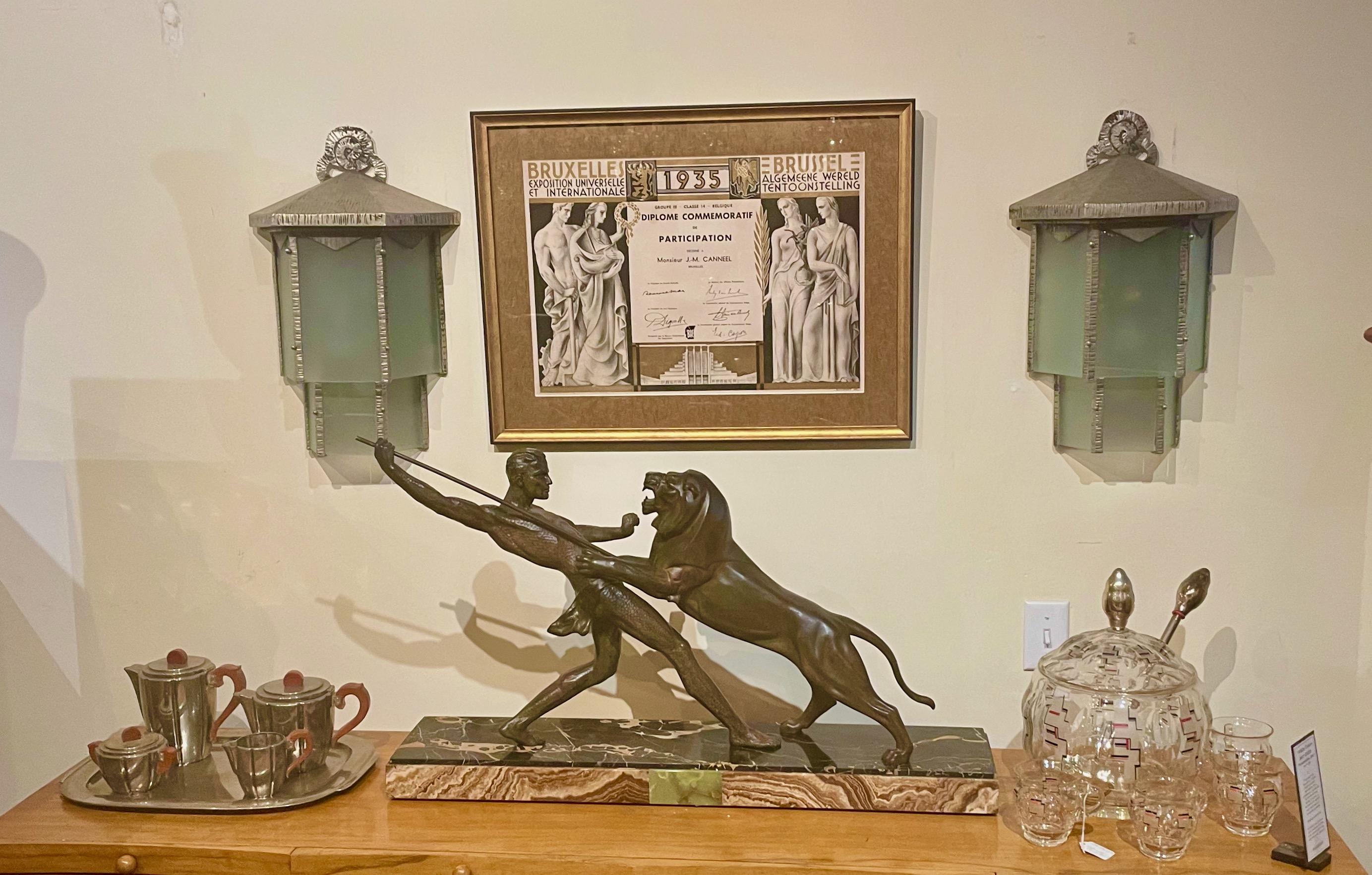 Art Deco Lion Hunter sculpture Signed by Limousin statue Circa 1930. Limousin ‘Hunter and Lion’ or Chasseur au lion. A Powerful Art Deco Study, in patinated art metal on a portoro marble base. The quality and condition overall are excellent. In the