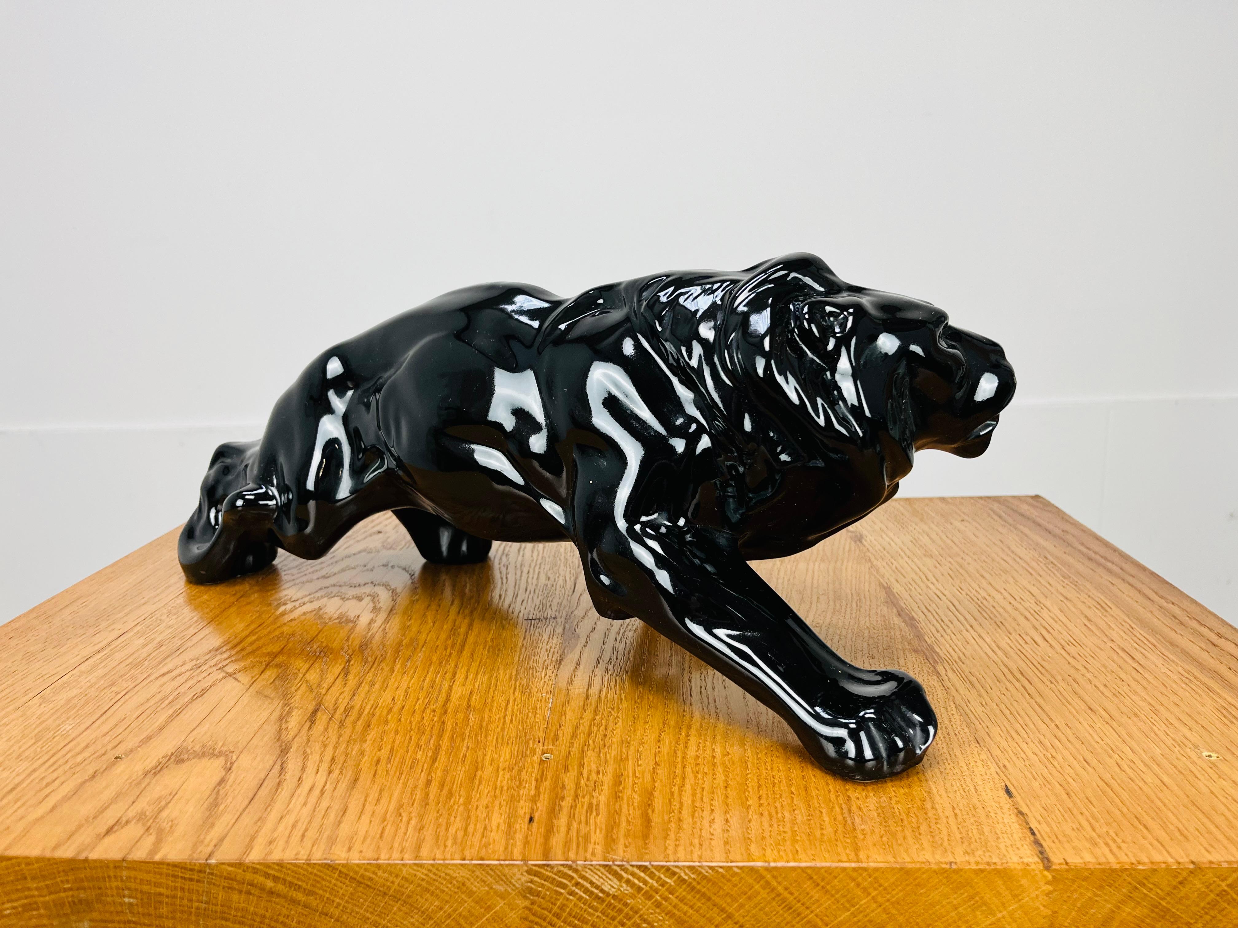 Ceramic Art Deco Lion sculpture, black ceramic, 1930's, in the style of Saint-Clément For Sale