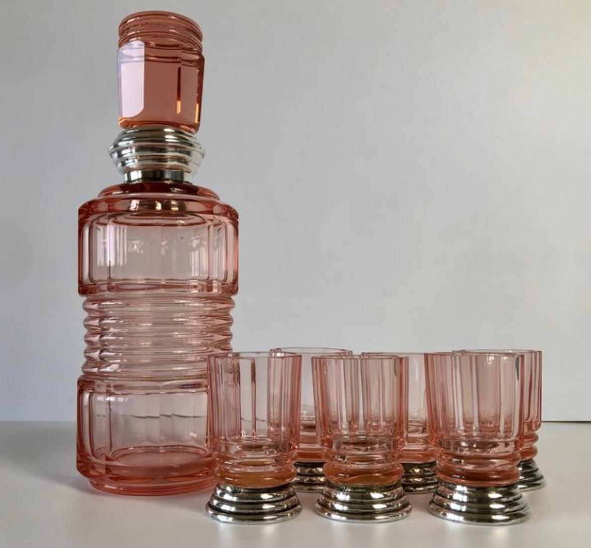 Art Decò Liqueur Set with Glasses Set with Silver 800. Antique liqueur set, consisting of a decanter and 6 small glasses in light pink facetted crystal, decorated with 800 stamped silver. Art Deco period and in excellent condition

This set is very