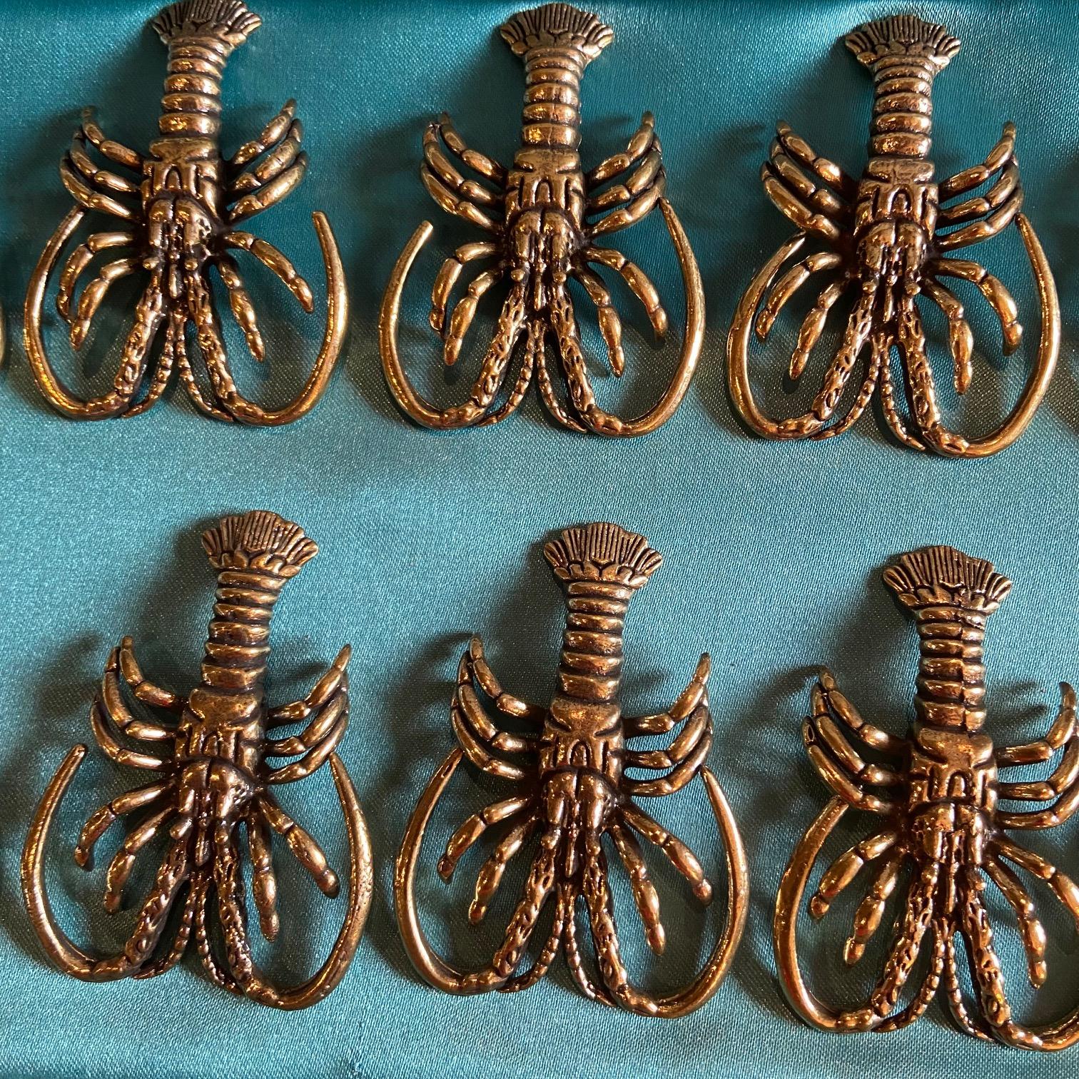 Set of 12 incredible bronze lobster knife rests.
Case exterior shows signs of wear.