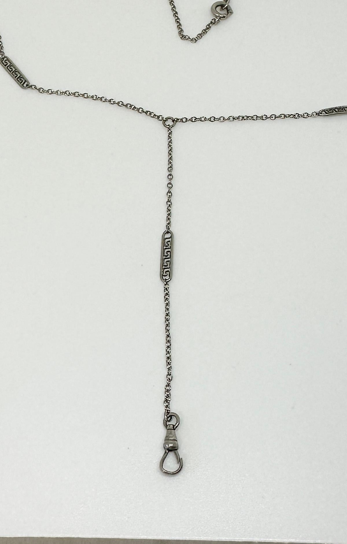 THIS IS A WONDERFUL ANTIQUE ART DECO FANCY LINK CHAIN NECKLACE IN STERLING SILVER WITH A MINIATURE DOG CLIP FOR HANGING YOUR FAVORITE LOCKET OR PENDANT AND STUNNING GREEK KEY MOTIF DECORATIVE LINKS THROUGHOUT THE CHAIN.
The chain has five Greek Key
