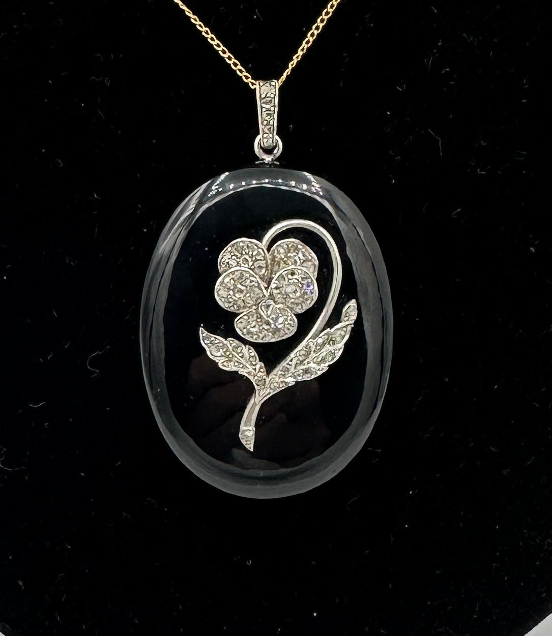 This is a magnificent Victorian to Art Deco Antique Rose Cut Diamond Platinum Locket Pendant with an exquisite diamond set Pansy Flower on the carved Black Onyx and Platinum locket.   The picture locket is one of the finest antique lockets we have
