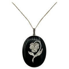 Ciondolo Art Deco con diamante taglio rosa in platino e fiore di viola del pensiero in onice nera