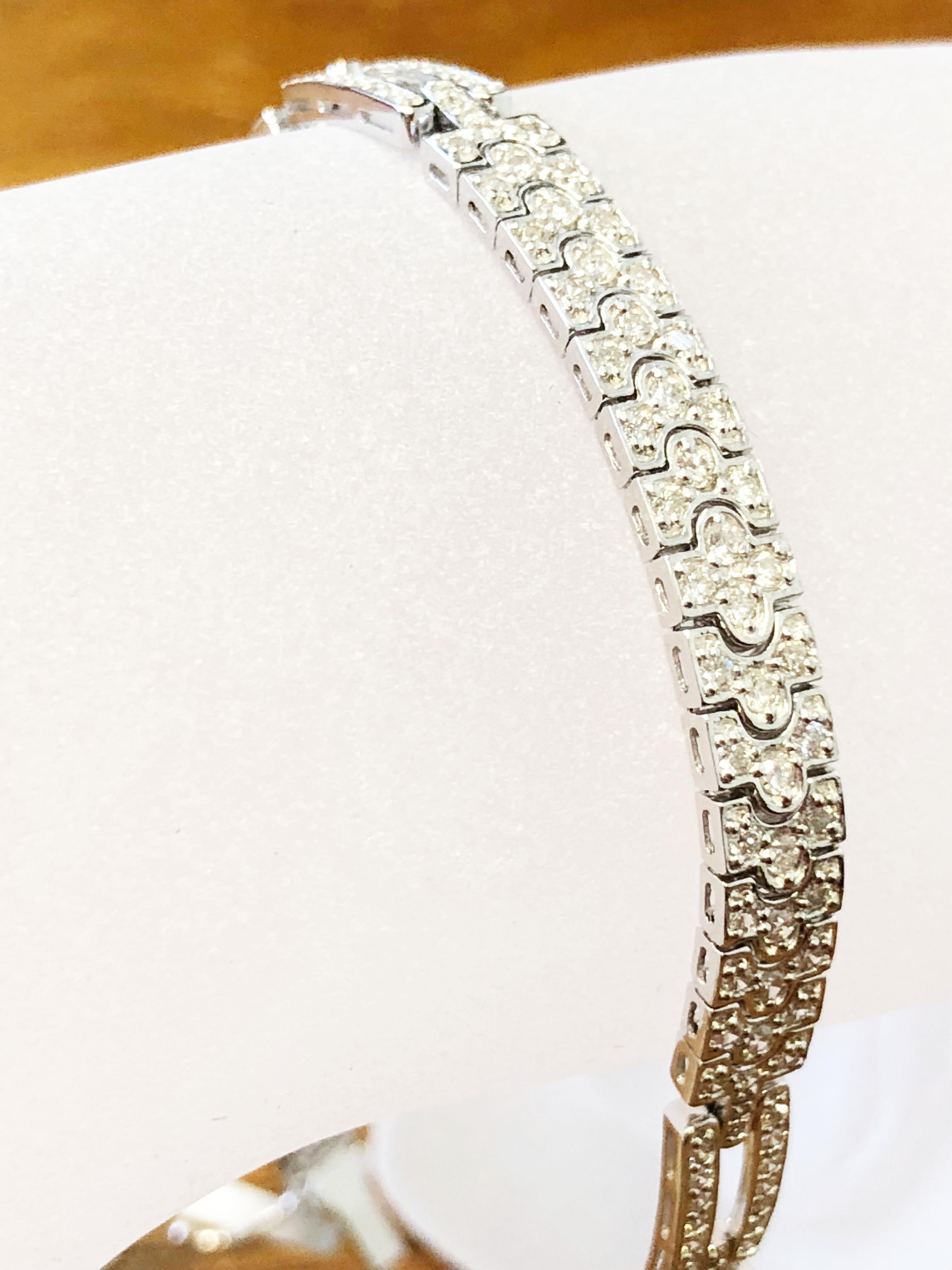 2.70 carats of good quality white diamond rounds in 18k white gold.  This art deco style look bracelet is simple and classy.  A perfect length of 7.5