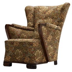 Fauteuil Art déco aux lignes sculpturales, en hêtre et tissu