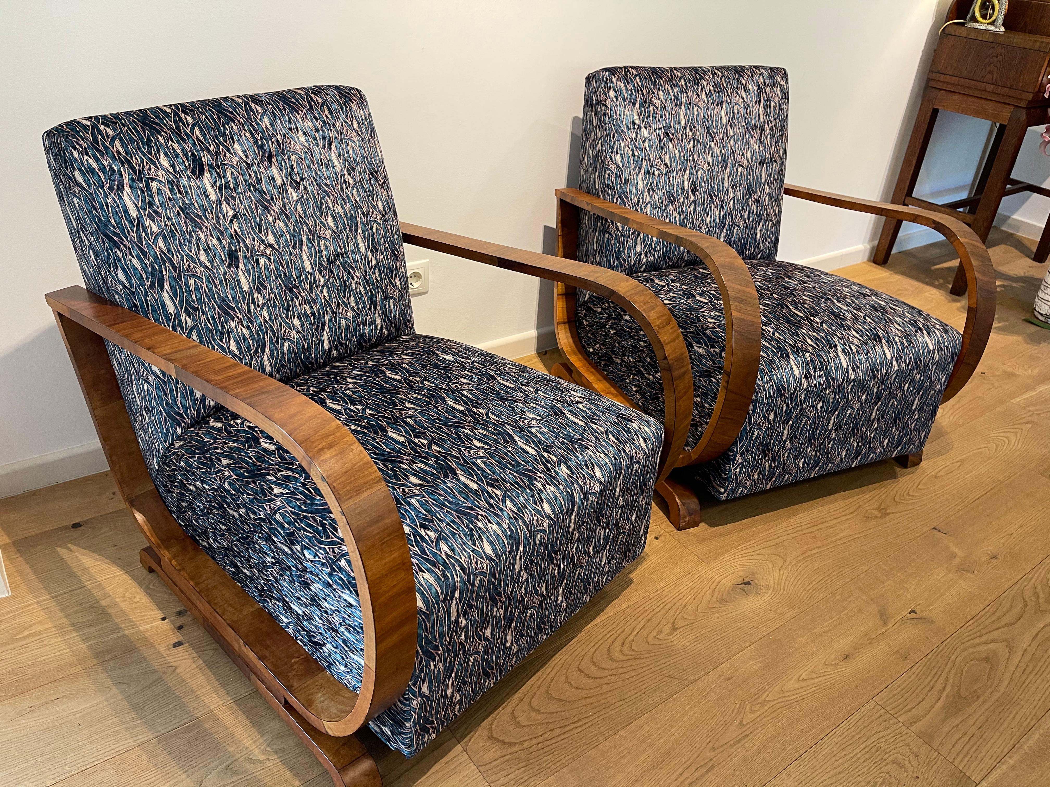 Extraordinary, gorgeous, 1930’s Art Deco pair of Lounge Chairs originating from France! Bent beechwood with walnut veneer. The walnut frame gives an expressive contrast for the sheen of the velvet upholstery. Dynamic appearance, organic curves. The