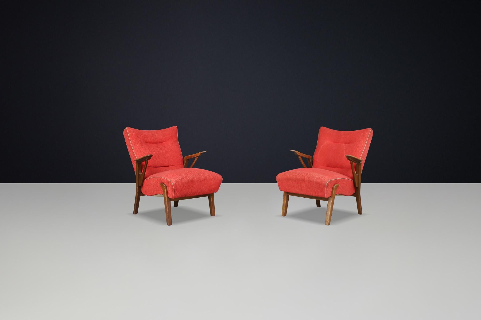 Art Deco lounge chairs in Oak and Original Upholstery By Antonin Kybal, CZ 1930s

We are excited to share a great example of Art Deco design with you.—a set of two oak armchairs attributed to Czech textile designer Antonín Kybal. Crafted in the