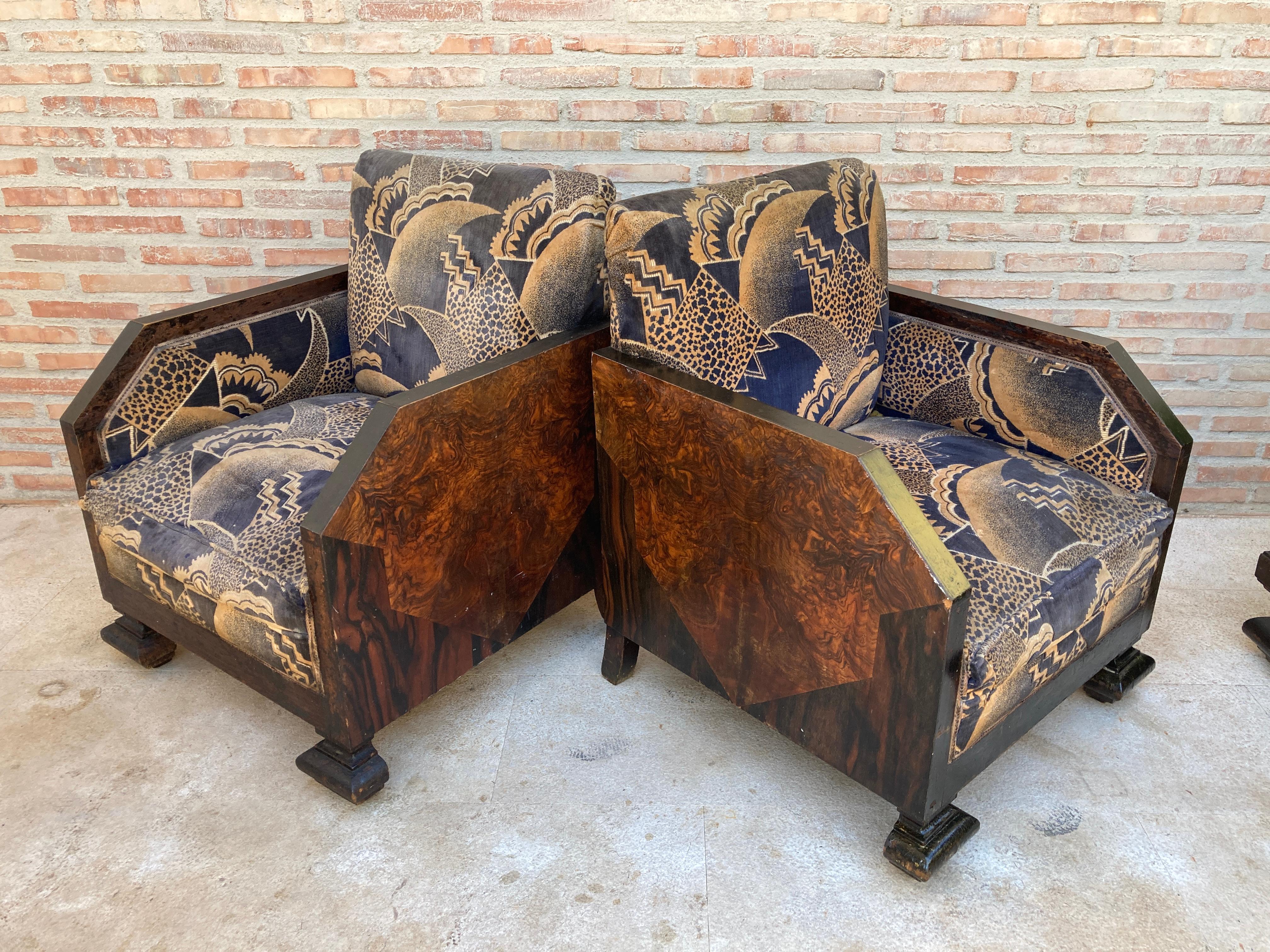 The shape of this pair of classic Art Deco armchairs is simply fabulous with its beautiful wooden frame along the front of the arms and seat. The back of this armchair is made of velvet fabric.

Use it as a centerpiece in a living room, hallway,