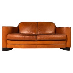Retro Art Deco Loveseat Sofa with Sculptural Arms in Patinaed Leather, USA, c. 1970s