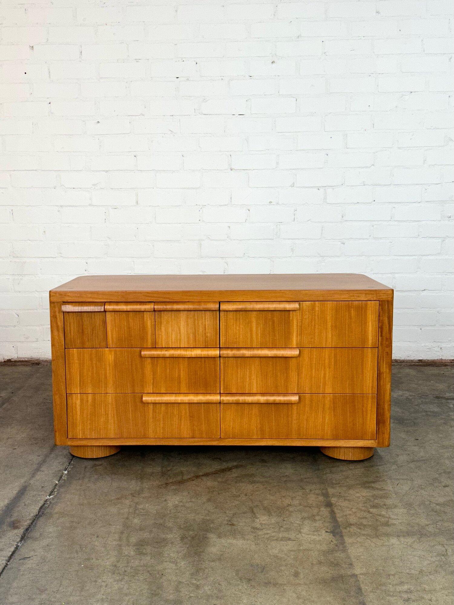 Dimensions: W48 D20 H26

Art Deco Low profile dresser in lightly restored condition. This one a kind dresser did have extensive damage when it arrived but some very unique details as well. Item is structurally sound and fully functional. Dressers