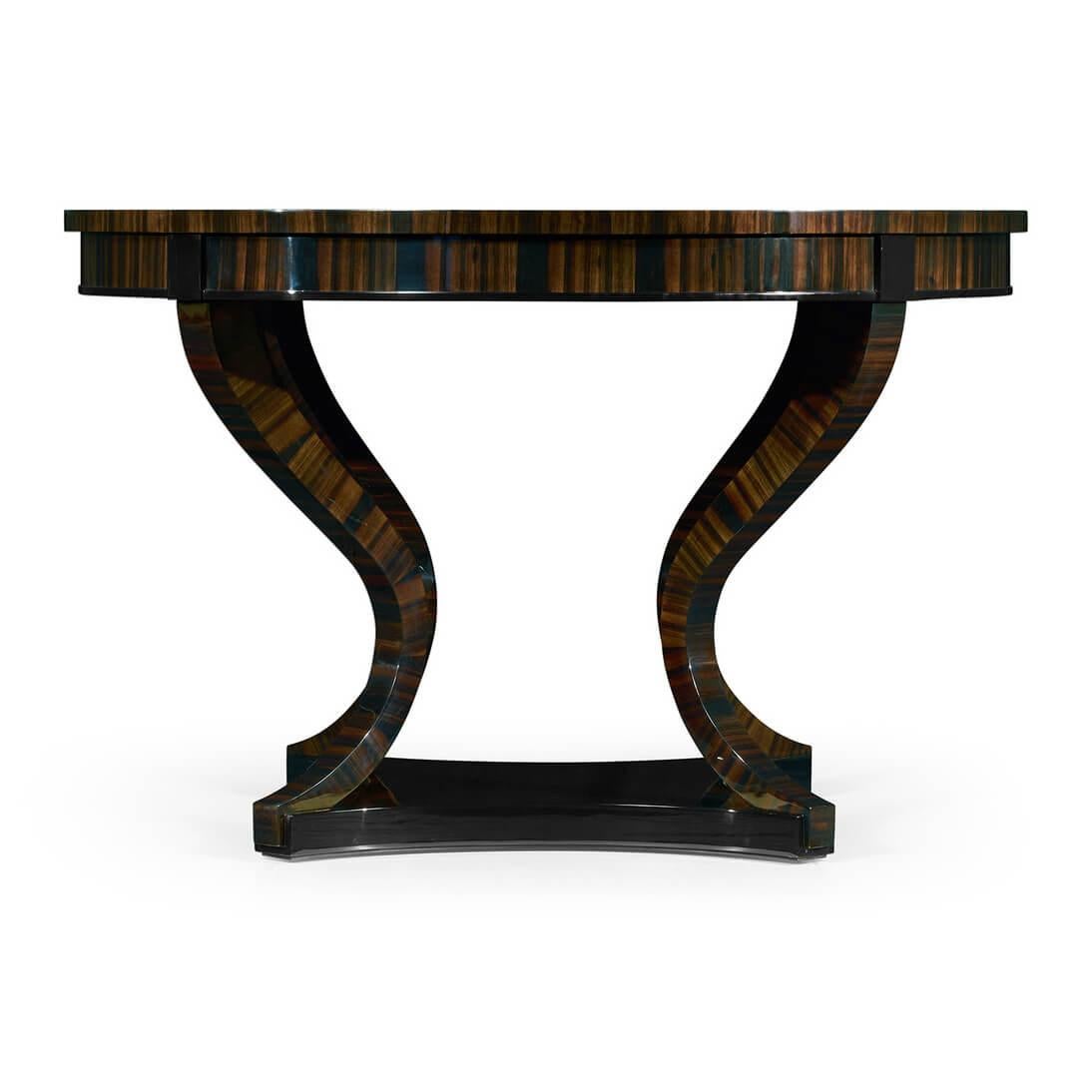 An Art Deco style Macassar ebony veneered round center table with in swept legs and shaped plinth base.

Dimension: 48 1/8