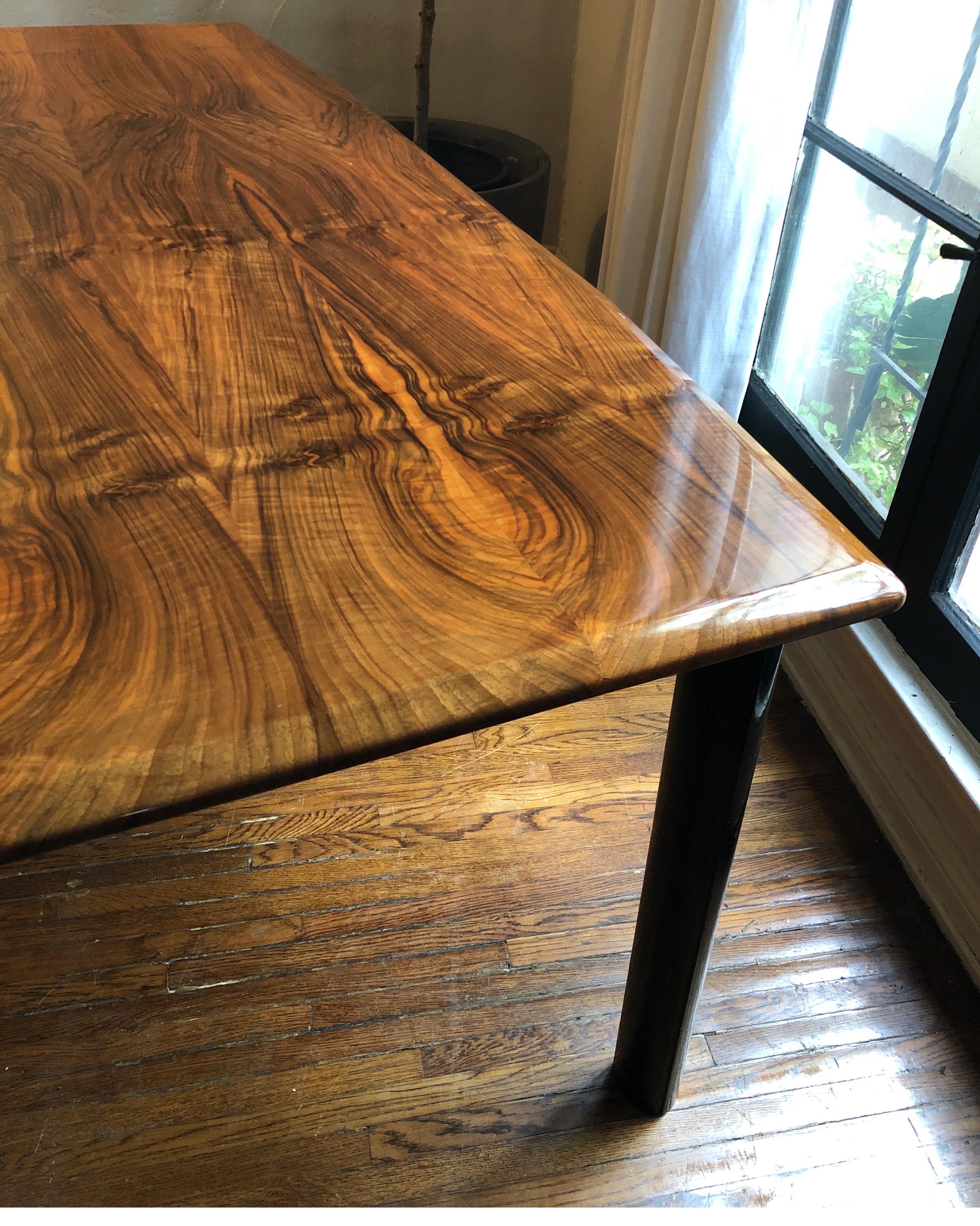 Gorgeous rectangular Macassar ebony wood sits atop a black lacquer base. Midcentury/Art Deco.
Beautiful solid woodgrain along the top. Edges have an interesting shape/detail. See pics.
Top does have some superficial scratches. Possibly polished