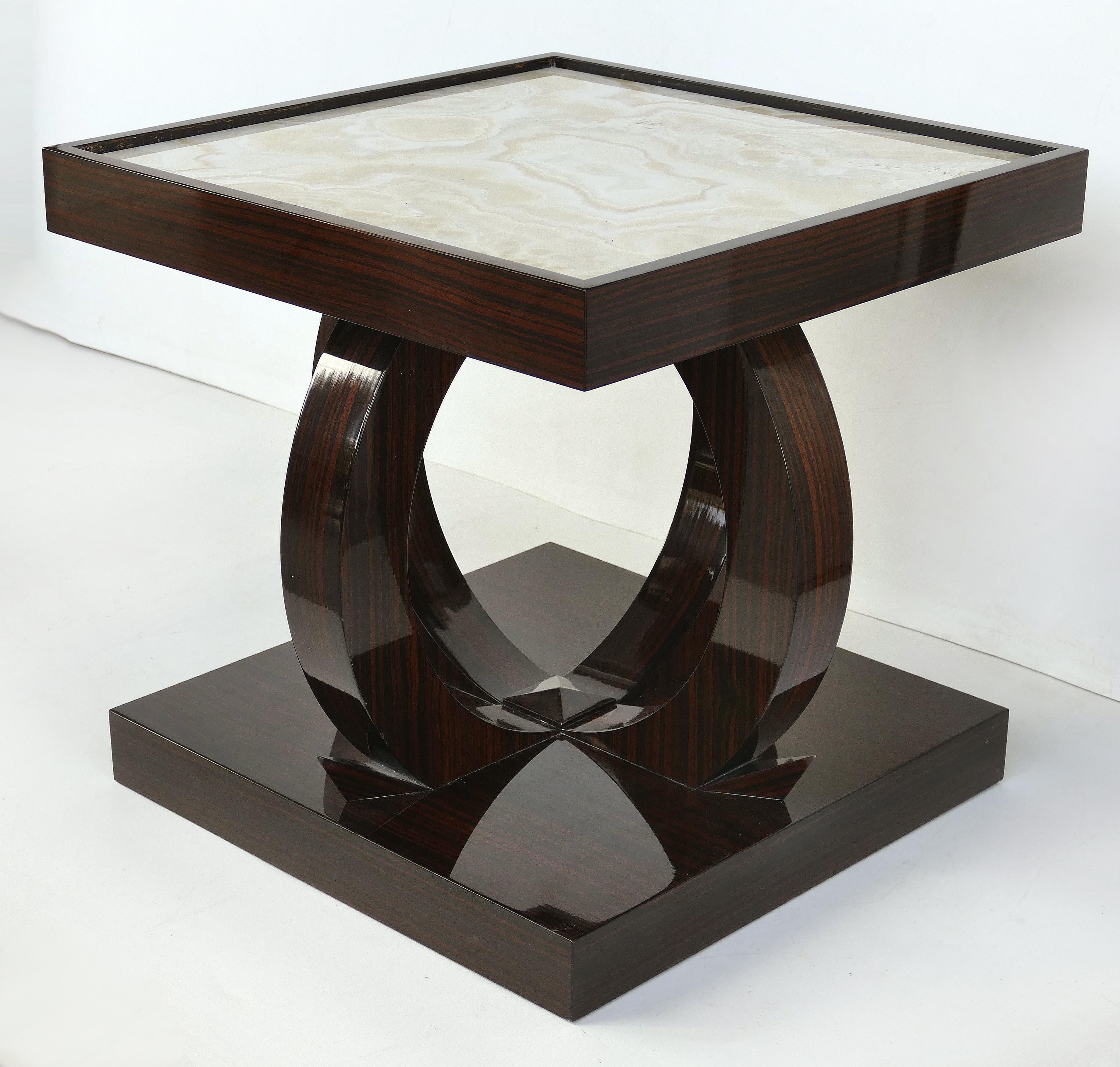 Art Deco Style Macassar Ebony Side Table with Onyx Top

Offered for sale is a custom made art deco style side table in Macassar ebony with an inset onyx top. The table is by John Wiggers for Carriage House and is a fine interpretation of a 1930s art