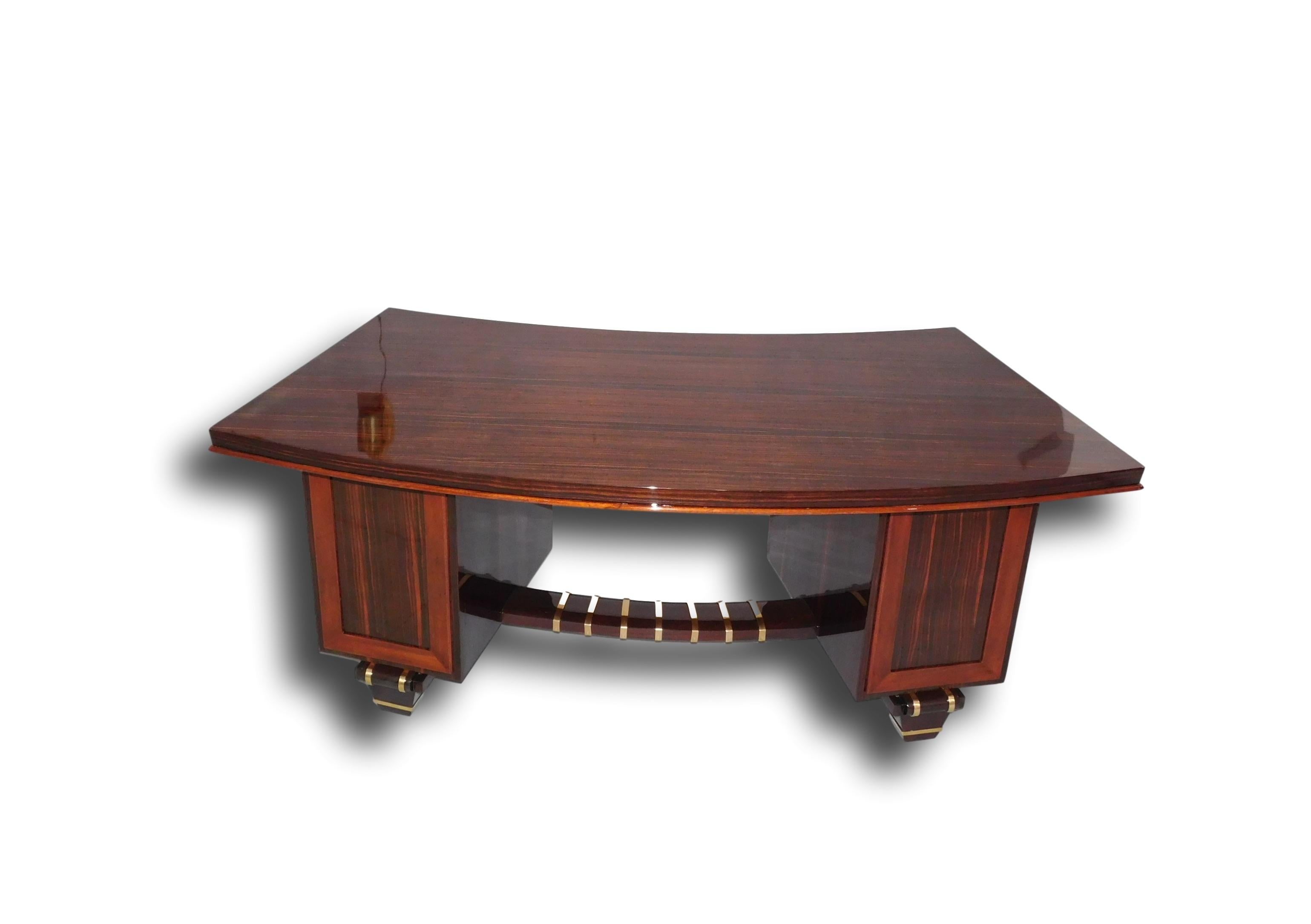 French Art Deco macassar ebony double pedestal desk in the manner of legendary Art Deco Parisian furniture and interior designer, Émile-Jacques Ruhlmann. This very important and rare desk will be a focal point in any office with its geometric shape