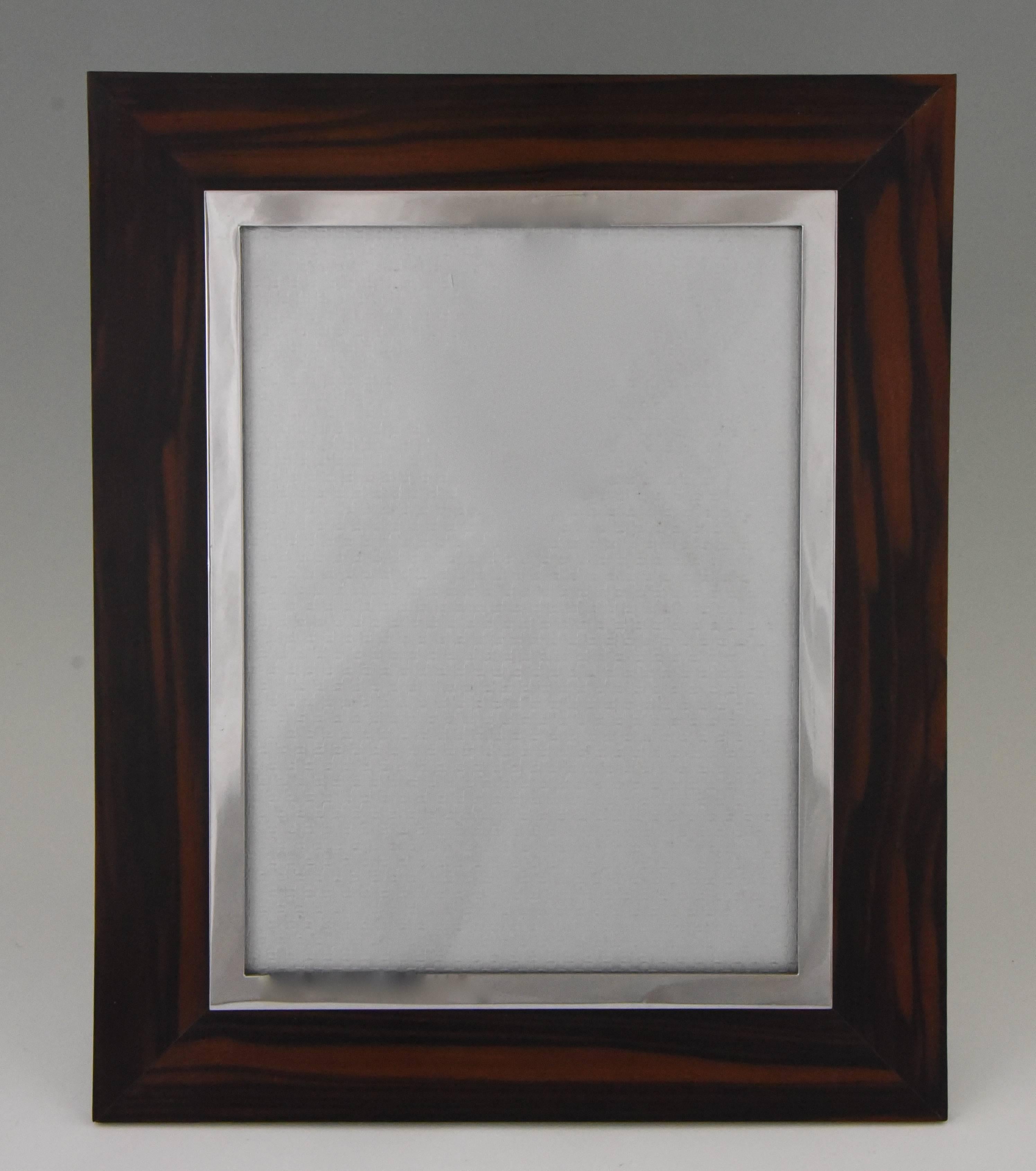 Large Art Deco Macassar wood and chrome picture photo frame.
Marked: Brevete SGDG
Style: Art Deco
Date: 1920
Material: Macassar wood, chromed brass.
Origin: France.
Size:
H. 33.5 cm x L. 27.3 cm. x W. 1.5 cm.
H. 13.2 inch x L. 10.8 inch x W.